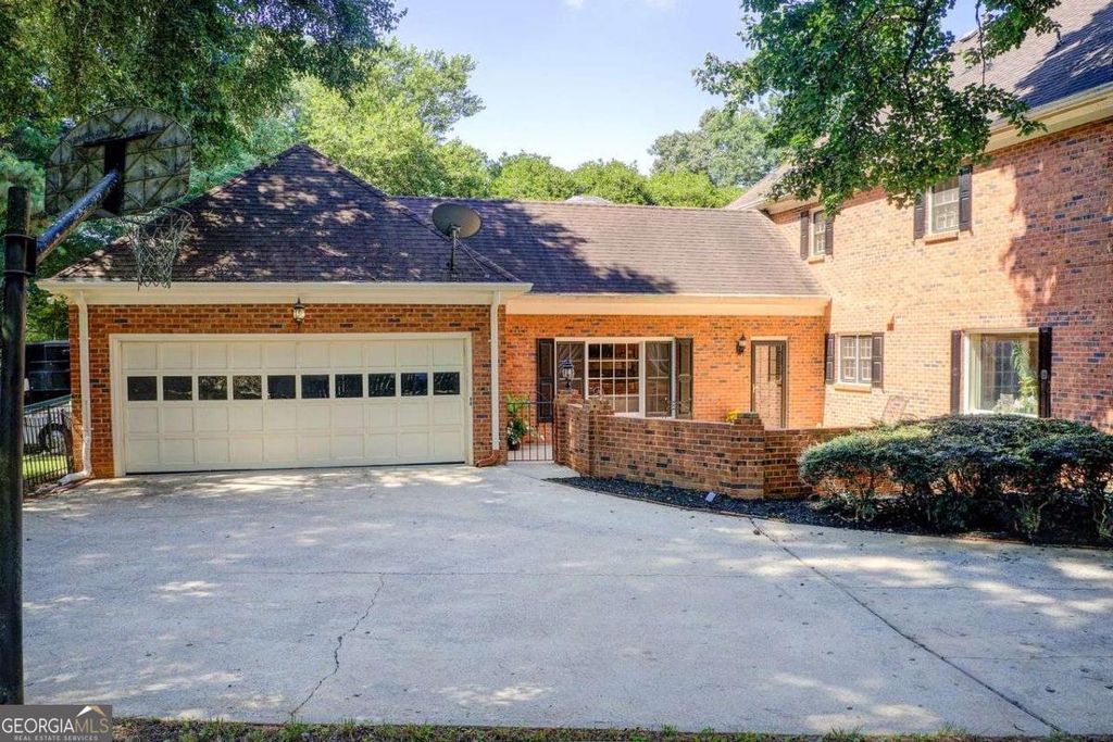 Photo of 854 Newcastle Drive SW, Lilburn, GA 30047 (MLS # 10709041)