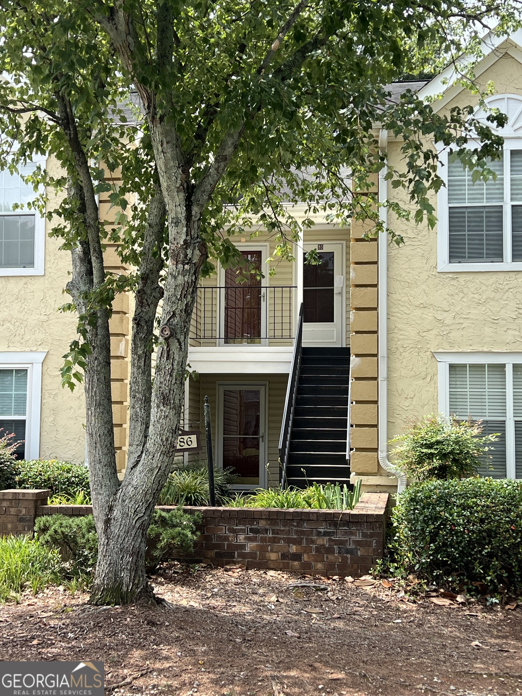 Price Reduced and Seller is offering an additional $5000 for buyer's closing costs!!!!! Come see this beautifully maintained 2-bedroom, 2-bath condo nestled in a quiet, well-kept community. Located on the second level, this spacious unit offers a sense of privacy and tranquility, backing up to a peaceful tree line. Inside, you'll find a bright, open layout featuring a cozy gas fireplace, stainless steel appliances, granite countertops, and plenty of cabinet space. The large screened-in porch is the perfect place to enjoy your morning coffee or unwind in the evening. Both bedrooms are generously sized, with ample closet space and natural light. Enjoy low-maintenance living in a serene setting-just minutes from shopping, dining, and commuter routes in sought-after Avondale Estates. Move-in ready and easy to love!