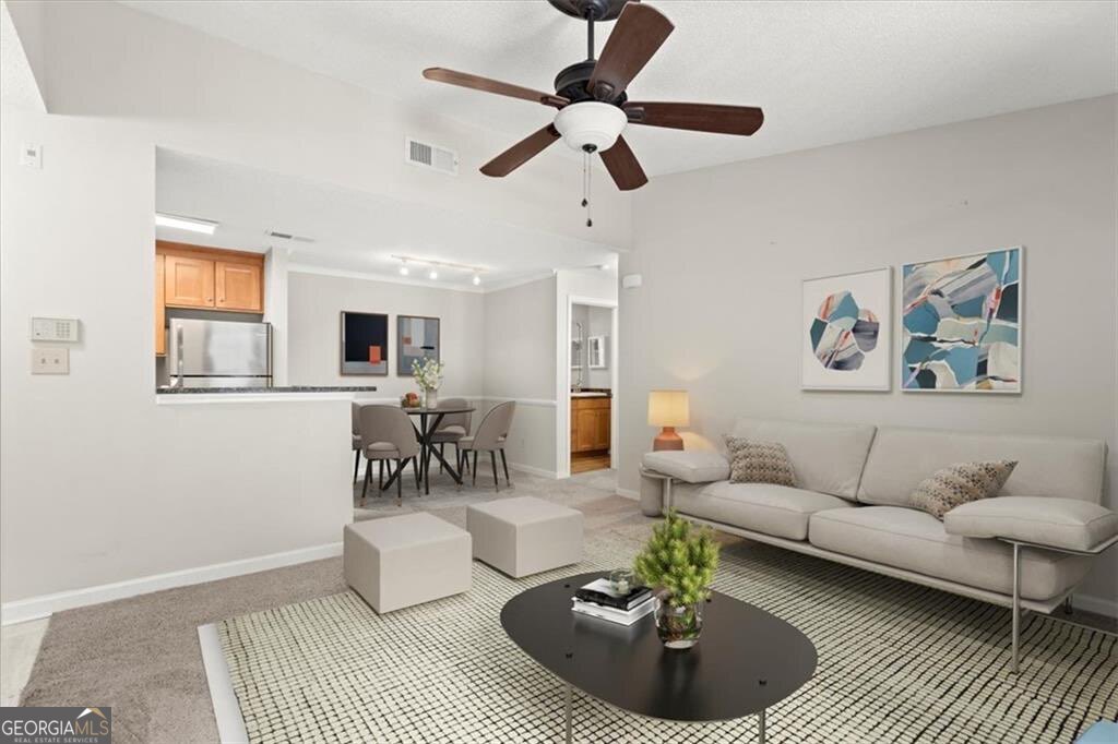 Welcome to your dream one-bedroom condo in the heart of Sandy Springs! This top-floor gem features vaulted ceilings that create a spacious, airy atmosphere, perfect for relaxation and entertaining. Enjoy modern living with stainless steel appliances in the kitchen, making meal prep a delight. Elevator access ensures convenience, while the large sliding glass door fills the space with natural light. Located just minutes from shopping, dining, public transit and parks, this condo offers the perfect blend of comfort and accessibility. This private, gated community offers covered and gated parking, swimming pool, fitness center, clubhouse and community carwash station. The Granville community maintains professionally landscaped and well kept common areas and also offers weekly concierge trash pick up from your front door. Don't miss the chance to make this stylish retreat your own! Owner financing available with 20% down.
