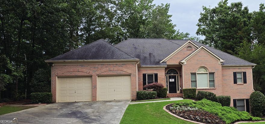 Welcome to this beautifully designed 5-bedroom, 4.5-bath home located in the desirable Fairways neighborhood in Towne Lake. With its versatile layout and full finished basement, this home is ideal for multi-generational living, in-law suites, or extended guests. The primary living spaces are conveniently situated on the main floor, including the generous primary suite with an oversized closet and en-suite bath, along with two additional bedrooms connected by a Jack-and-Jill bathroom. You'll also find two linen closets for extra storage on this side of the home. The bright, welcoming foyer opens to a formal living room with a large picture window overlooking the freshly resurfaced deck and private, landscaped backyard. The heart of the home centers around the open kitchen, complete with a breakfast room, breakfast bar, kitchen island, walk-in pantry, stained cabinets, and granite countertops-all with a view to the inviting family room. Anchoring the family room is a cozy fireplace flanked by custom built-in bookcases. French doors lead from the family room to the expansive deck, perfect for outdoor entertaining. Tucked away off the main living area is a powder room and a large laundry room for added convenience. Upstairs, you'll find a private bedroom with a full bath and walk-in storage, offering a perfect guest suite, teen retreat, or home office. Downstairs, the full finished basement-with exterior entry-features a complete apartment setup, ideal for in-laws or guests, plus a dedicated shop area perfect for hobbies, crafts, or extra storage. The basement mirrors the footprint of the main level, offering tremendous flexibility for a variety of uses. With thoughtful design, flexible living spaces, and a prime location in one of Towne Lake's most desirable neighborhoods, this home is ready to welcome its next owner. Don't miss your chance to make it yours-schedule your private tour today!
