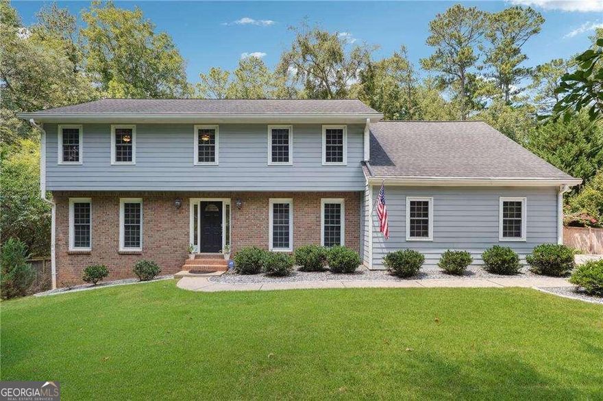 Welcome to this beautifully upgraded 4-bedroom, 2.5-bath home in the heart of Alpharetta. Conveniently located just a mile from Highway 400 Exit 9 and minutes from shopping, dining, and restaurants. Upgrades include new washer, dryer (3 years), new refrigerator (1 year), new electrical panel (2 years), new 3.5 Ton AC unit installed with new nest thermostats, bamboo scratch resistant flooring throughout, renovated bedrooms, new tile in kitchen floor, and new dishwasher. Inside, you'll find a cozy family room with a fireplace, a kitchen with white cabinets, granite countertops, a gas range, and a breakfast nook. Main level also includes a formal dining room, sitting room, and office. Primary suite boasts a spa-like bathroom with a soaking tub, separate shower, and dual vanity. Upstairs, there are three additional bedrooms and a full bath. Enjoy the sunroom with ample natural light, and relax on the spacious deck overlooking the fenced, private backyard. Schedule your showing today!