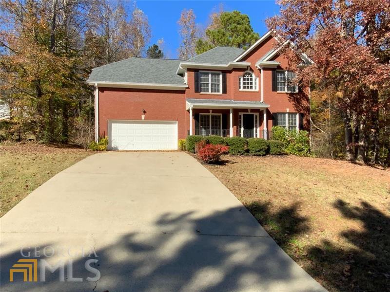 Do not miss your chance to be a part of this incredible neighborhood in a highly desired school district, and the home of the Atlanta Falcons Training Facility. Walk from your back yard to the community lake, pool, private walking trails, playground or tennis and basketball courts. This community has something for everyone! Level driveway, Master on Main, Ranch, 2 Car Garage, 9ft plus ceilings, and an In-Law Suite. This house has it all! Walk inside and enjoy the vaulted ceilings of the great room. Enjoy the warmth from the fire, the flawless hardwoods, and the open floor plan from living room to dining room. The view from the kitchen to the living room offers a nice flow while also allowing you to prepare food in private and out of the way of visitors seeing any mess.