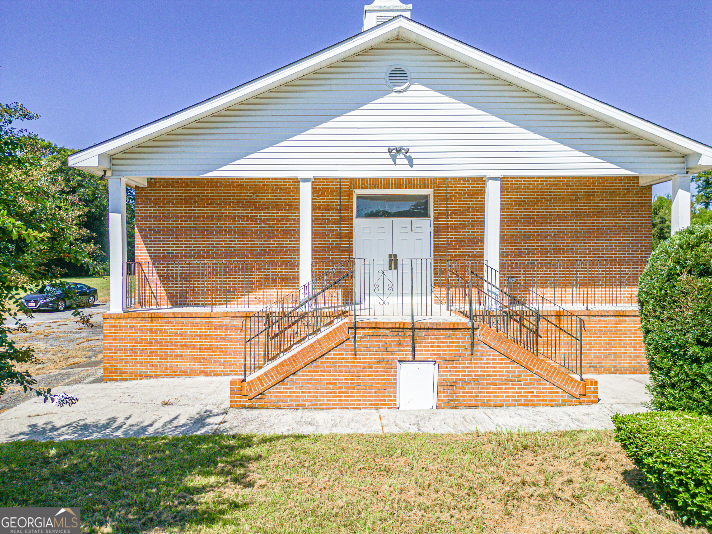 Discover an exceptional opportunity with this spacious church property, perfectly situated in Macon, GA. Spanning two lots and 3,792 sq. ft., this well-maintained building is designed to accommodate a variety of ministry or community needs. Inside, you'll find a large sanctuary ideal for worship services or gatherings, along with two private offices for administrative use. The property also features four classrooms-perfect for children's programs, meetings, or study groups-as well as four restrooms for convenience. Additional highlights include a security system for peace of mind and ample space for flexible use. With its thoughtful layout and central location, this property is well-suited for churches, outreach centers, or other community-focused organizations.