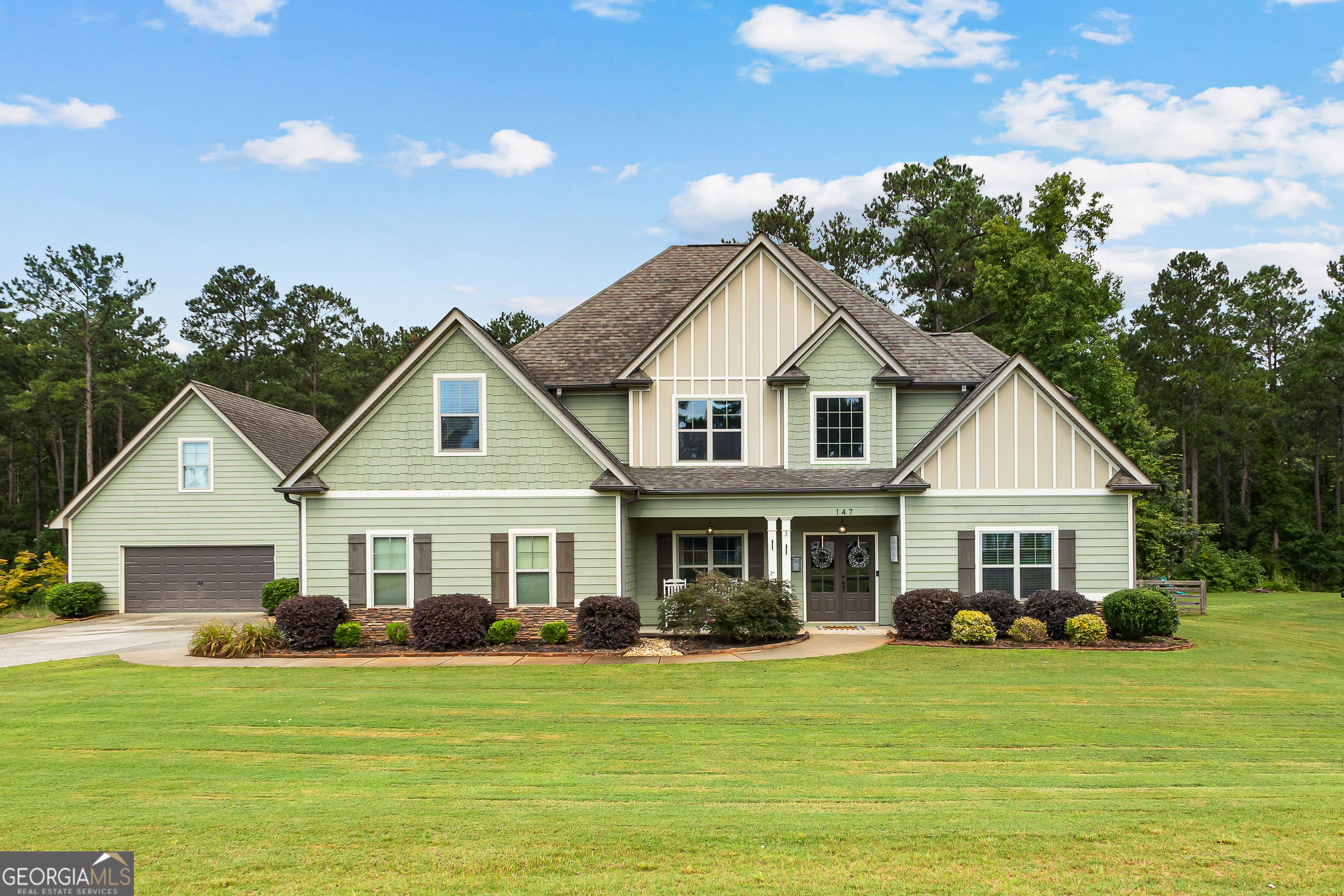 Welcome to your dream home in beautiful Senoia! This 5-bedroom, 3.5-bath masterpiece offers style, space, and resort-style amenities you'll fall in love with. The detached garage features an extra room perfect for guests, a private office, or a hobby retreat. Inside, the open-concept kitchen is the heart of the home with a huge center island, ideal for entertaining, and flows seamlessly into the living and dining spaces. The primary suite is a true retreat with a walk-in closet and double vanity in the spa-like bath. Every detail has been designed for comfort and function from the mudroom with laundry to the inviting bedrooms and spacious layout. Step outside and prepare to be amazed: a sparkling pool with full screen enclosure, expansive patio, and pavilion with an outdoor kitchen create the ultimate backyard oasis for year-round fun. Don't wait, this showstopper won't last long!