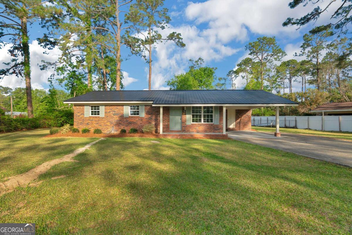 Welcome to this beautifully updated 3-bedroom, 2-bathroom brick home located in the heart of Blackshear! Completely remodeled from top to bottom, this move-in-ready property offers the perfect blend of modern updates and charming curb appeal. Step inside to find brand new flooring, fresh interior and exterior paint, and stylish new cabinets and countertops throughout the kitchen and bathrooms. Every detail has been thoughtfully upgraded, including a new roof, new plumbing and electrical finishes, new appliances, and new windows and doors, ensuring peace of mind and energy efficiency for years to come. The spacious layout is perfect for comfortable living, and the large backyard features a generously sized shop-ideal for storage, hobbies, or a workspace. Don't miss your chance to own this like-new home in a quiet, established neighborhood. Schedule your showing today and fall in love with all the updates this home has to offer! One of the sellers is a licensed real estate agent in the state of Georgia.