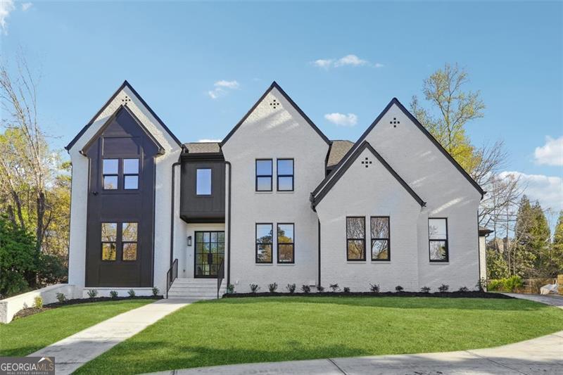 Impressive New/Under Construction home in the prestigious Indian Hills golf course country club community. This stunning home features custom finishes and An exceptional floor plan with thoughtful details throughout and features including TWO MASTERS, a large, sun-drenched, 2-story foyer, a designer chef's kitchen with custom cabinetry showcasing high-end hardware is the perfect complement to the quartz countertops, and the elite appliance package ready for any chef inspired gourmet meals or to enjoy a glass of wine. A spacious living room with fireplace with stunning glass sliding doors that open up to the large outdoor patio overlooking a beautiful backyard, same level as first floor with ample space for a pool. Admired one OWNER SUITE ON MAIN offering an oversized walk-in closet .The second level also features Second Master, And 3 spacious bedrooms with walk in closet , and dedicated ensuite bathrooms. The Partially finished daylight basement with one bedroom / full bathroom, has endless possibilities for building during construction, media room/living room, wet bar/kitchen, exercise room.. Located in a top-rated school district and close to interstates, shopping, and dining, this home offers the perfect combination of luxury, convenience, and comfort.