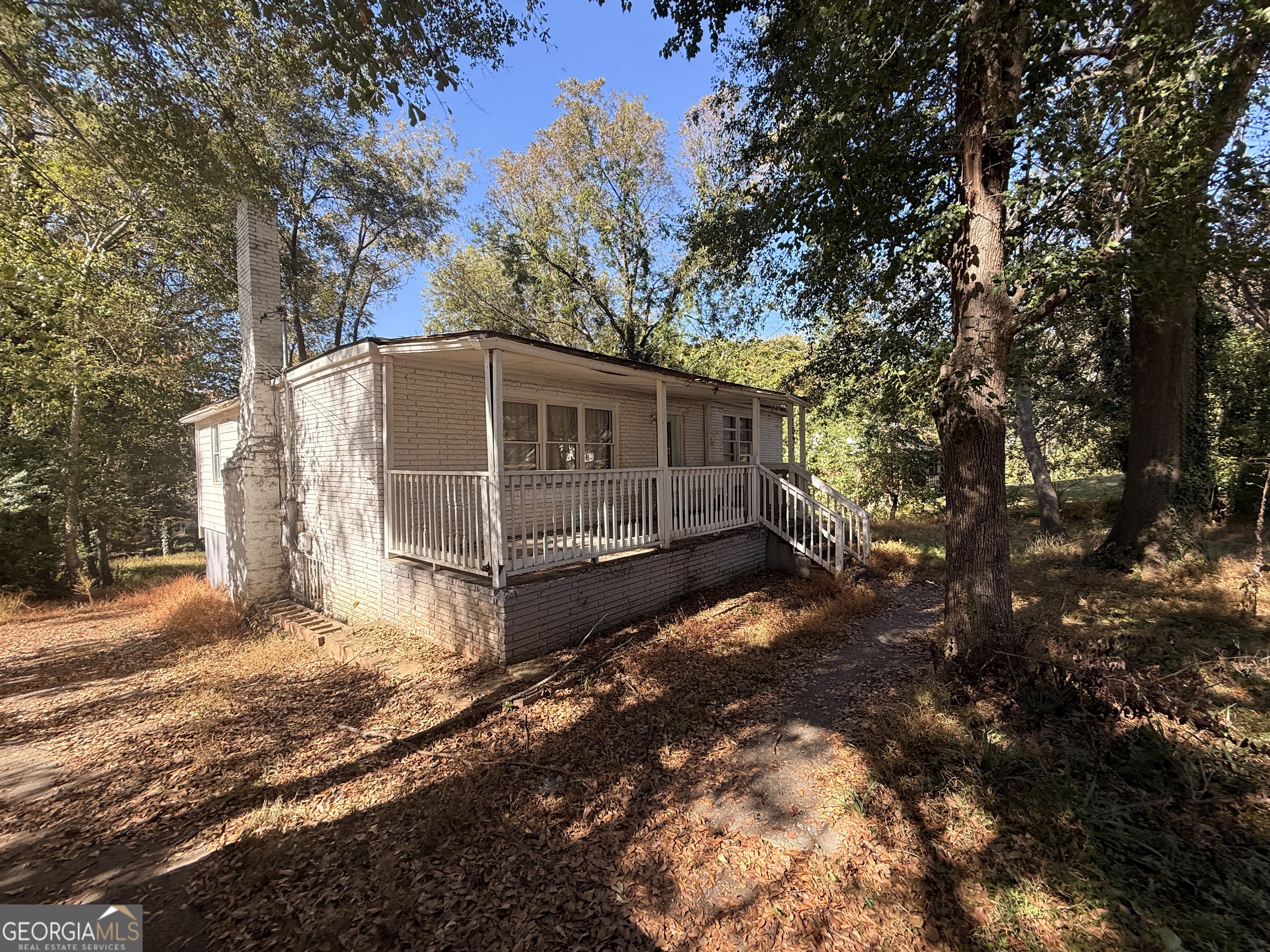 1093 Kipling St SE, Atlanta, GA 30315 is a 3-bedroom, 2-bath ranch on a spacious 0.32-acre lot in Thomasville Park. This property features an open, light-filled floor plan with hardwood-style floors and a cozy fireplace. Enjoy outdoor living on the covered rear porch and convenient driveway parking. With central air, gas forced-air heating, and no HOA, this home offers solid potential in a desirable location for those ready to roll up their sleeves.