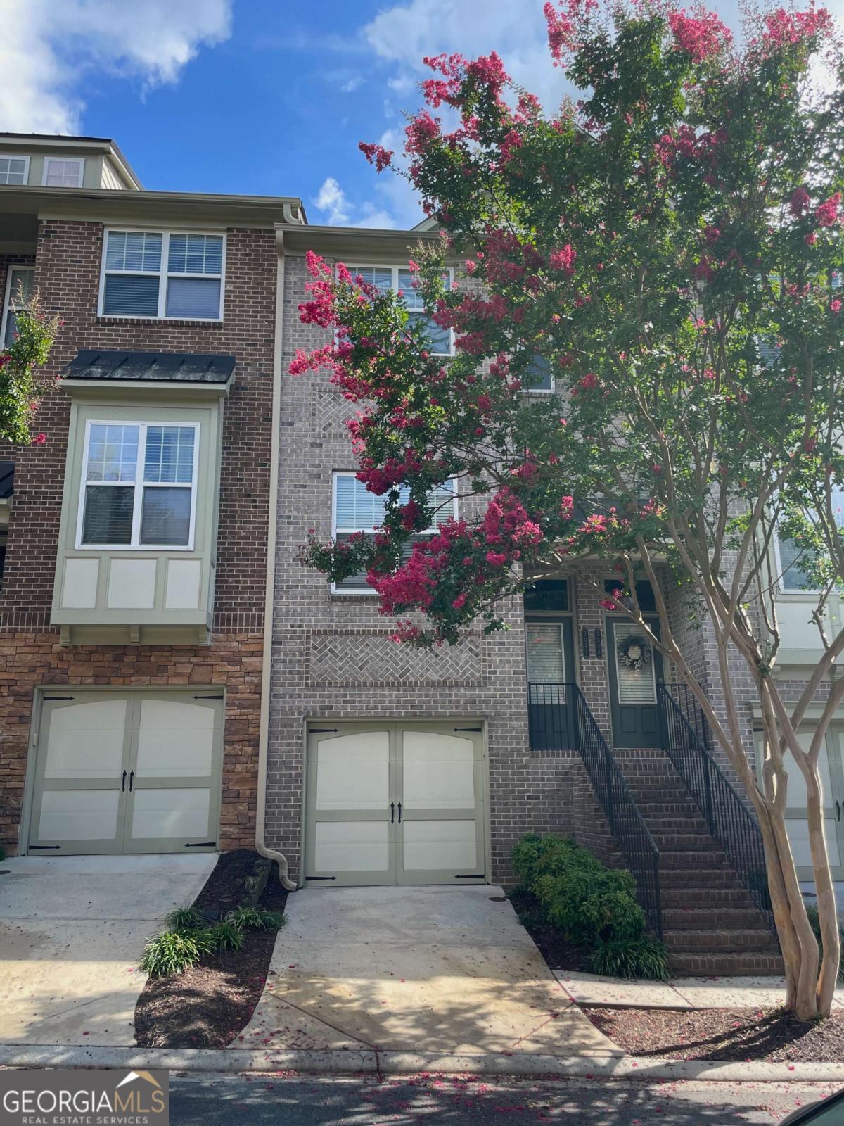 Don't miss out on this BEAUTIFUL townhome in sought-after, Cobblestone at Brookhaven! Perfect split 3 bedroom floor plan, each with a private bath. Main level provides hardwood floors throughout, separate dining room/office space, kitchen, half bath and large living room with plenty of sunlight. Secluded balcony off the living room backing up to wooded area. Large primary bedroom upstairs with trey ceilings, spacious custom walk-in closet, ensuite bathroom with double vanity, standing shower, and soaking tub. Upstairs you'll also find the second bedroom with a walk-in closet and private bath, and the laundry room with NEW W/D included. Ground level has the third bedroom with ensuite bath and access to the private patio. This home features a one-car garage with an additional parking space in the driveway. Plenty of storage, as well as a New A/C unit and Fridge! Immaculate and quiet gated community with private pool, ample guest parking, conveniently located off Briarwood, easy access to 1-85, 400, Dresden shops/restaurants and Briarwood Park. Available for lease starting 9/12/25! Tenant occupied, please allow 24 hour notice.