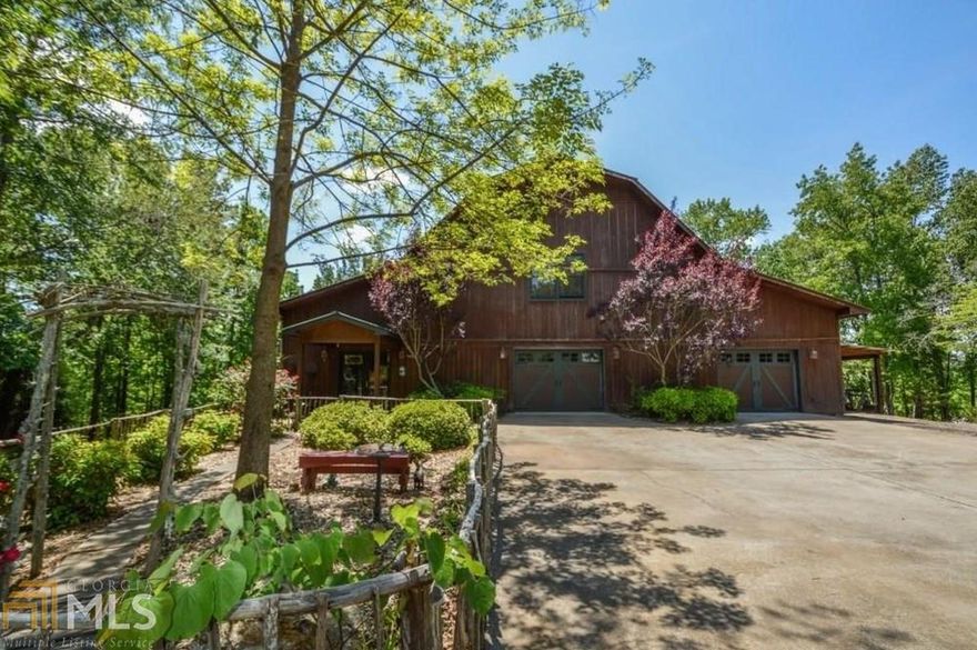 Prettiest property in Adairsville. Private & Peaceful getaway on 36 acres, mostly wooded, beautifully landscaped w/ barn home. Open concept & unique design recently renovated w/ all new main level paint and custom Shiplap wall w/ barn doors. Enormous 2-3 car garage with utility tub and work space. Underground utilities, hiking trails, minutes to I75 and shopping. Zoned HVAC, walk in pantry & high ceilings. Wood stove for alternate heat. Relax in the evening around a stone fire pit steps from your front door. Several building sites with endless possibilities!