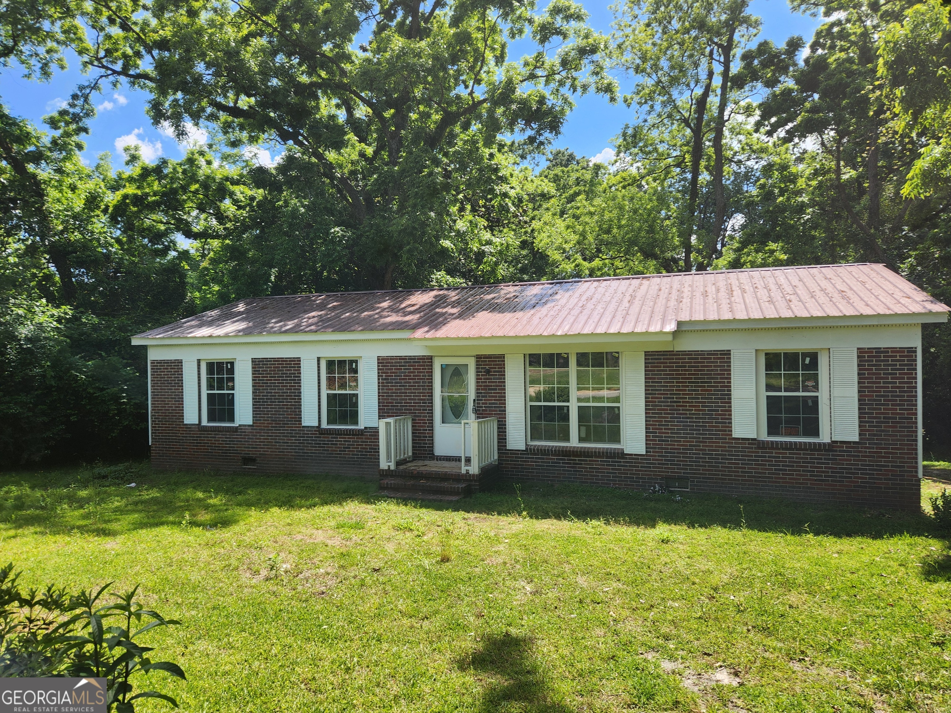COMPLETELY REMODELED FROM TOP TO BOTTOM!!!! This cute 4 br 2 bath home would be a great first home for a wonderful family. This home also includes: NEW paint, flooring, cabinets and countertops. This home is a MUST SEE!!. You will not be disappointed..... Appliances Included!!! Call your Realtor ASAP!!! SELLER IS MOTIVATED!!!