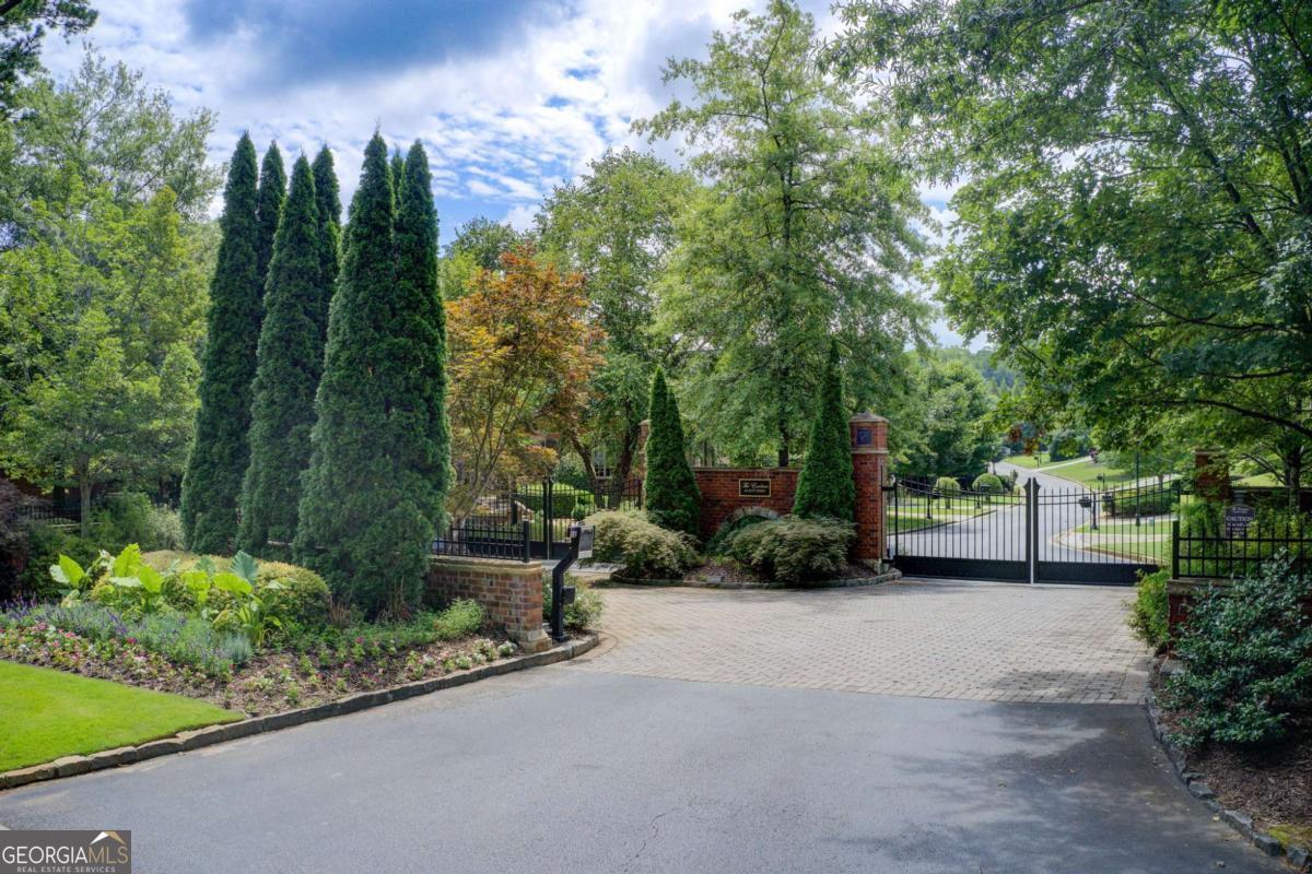 Back on the Market with Verified Buildability-Your Rare Opportunity for the Final Homesite in The Enclave at Jett Ferry. 3869 Teesdale Court is not just a lot with potential. It's a prime buildable, investment-ready residential parcel ready for your custom luxury home in one of the most exclusive gated neighborhoods in Sandy Springs. Past listings lacked key facts about impervious, disturbance, and soil. We have them in specially-commissioned reports by survey firms. Compass Real Estate proudly presents this fully-qualified 1.49-acre lot in a coveted community known for its privacy, prestige, and natural beauty. Tucked at the end of a quiet cul-de-sac, this expansive lot offers the perfect blend of serenity and convenience with 180 feet of Frontage. Enjoy uninterrupted views of the Chattahoochee Nature Preserve, surrounded by mature trees and lush landscapes. Unmatched backdrop for your personalized design in a central location. This exclusive neighborhood features just 36 homes of $1.5 million or more. Minutes from the Dunwoody Country Club, high-end shopping, and fine dining, with quick access to Sandy Springs, Roswell, Buckhead, and major interstates. Families will appreciate top-rated public and private schools nearby, along with recreational trails and parks that enhance your quality of life. Whether you envision a private retreat or a statement estate, this lot offers an oasis of space, setting, and prestige that can bring your dreams to life. Opportunities like this don't come often. Bring your builder and secure your place in one of Atlanta's most distinguished neighborhoods. 3869 Teesdale Court is READY, BUILDABLE, VALUABLE.