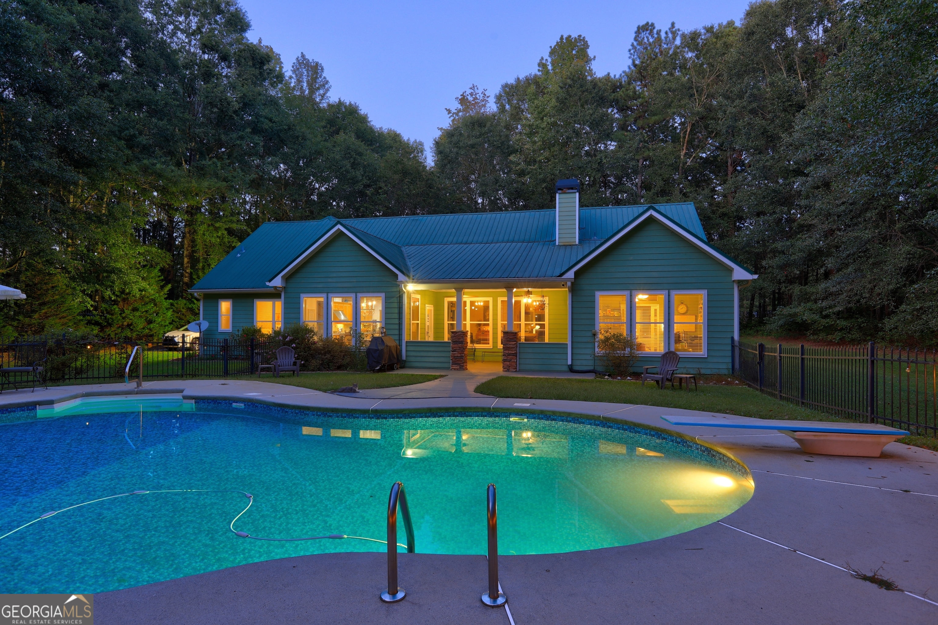 **Charming 4 Bedroom Home on 3 Acres with In-Ground Pool** Welcome to your dream retreat! Nestled on a sprawling 3-acre lot of hardwoods providing a private oasis from the busy world. This stunning 4 bedroom, 4-bathroom home offers the perfect blend of luxury and comfort. Step inside to discover an inviting open concept layout adorned with beautiful hardwood floors throughout the main level. The spacious living room features a soaring vaulted ceiling and a cozy brick fireplace with gas logs, creating a warm ambiance for gatherings. The gourmet kitchen is a chef's delight, complete with stainless steel appliances, a gas stove, well-appointed cabinetry, and a central island with seating that opens seamlessly into the family room. This design allows for effortless entertaining and family time. Retreat to the luxurious owner's suite, where you'll find another inviting fireplace and a spa-like ensuite bath equipped with dual vanities, a jetted tub, and a generous closet. The owners suit e opens to a lovely sunroom with access to the porch. Two additional bedrooms on the main floor provide ample space for family or guests, accompanied by two well-designed full baths and a large laundry room for added convenience. Venture upstairs to discover a versatile bonus room, separated by charming barn doors, perfect for a home office, playroom, along with a lovely guest suite. There is also an additional room upstairs to use as a buyer sees fit. This space boasts its own private entrance, offering flexibility for overnight guests or additional privacy. This space could easily accommodate an AIR B&B opportunity, as well. Step outside to your own backyard oasis! The expansive covered back porch overlooks the sparkling in-ground pool and a charming gazebo, perfect for entertaining family and friends during warm summer days. This backyard is also has fencing on two sides. The detached building offers storage or workshop space. This property combines serene country living with modern amenities, making it the ideal home for those seeking privacy and comfort. Located in the established gratis area with large lots. 10 Minutes from 316 in Bethlehem, 5 minutes to Hwy 78, with easy access to Athens. Don't miss your chance to own this exquisite home with breathtaking views and endless possibilities!