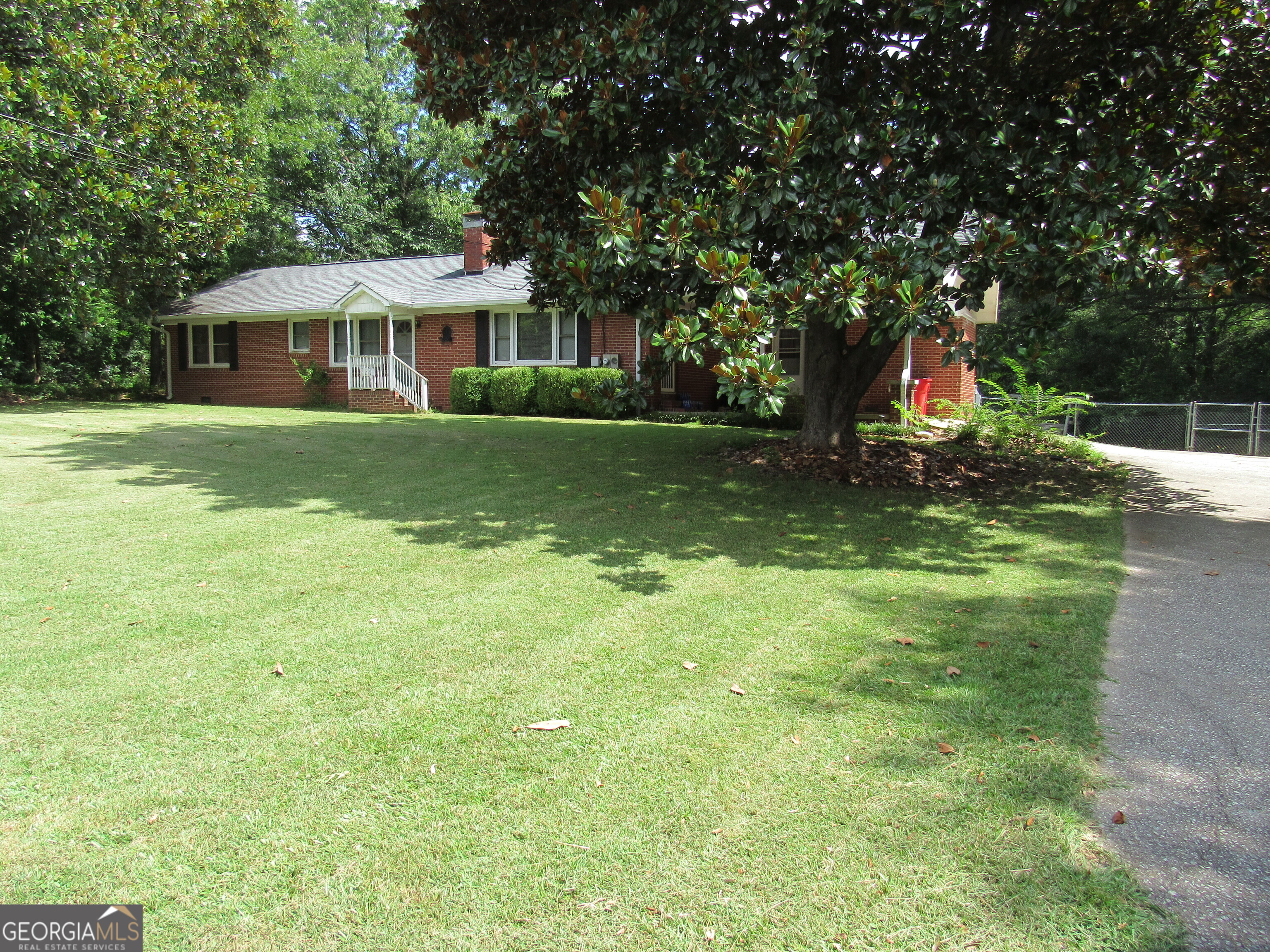 Big and beautiful, with brick on all 4 sides! They don't make them like this anymore! Located in the heart of Bowdon, this 1800+ sq ft home is waiting on a new family! New AC, newer appliances, 3 bedrooms and an office! New chain link fence in the backyard for your fluffy friends! New paint, new LVP, office has original hardwood flooring. Carport and additional parking for your friends. Outbuilding stays! This home has been loved and it shows!
