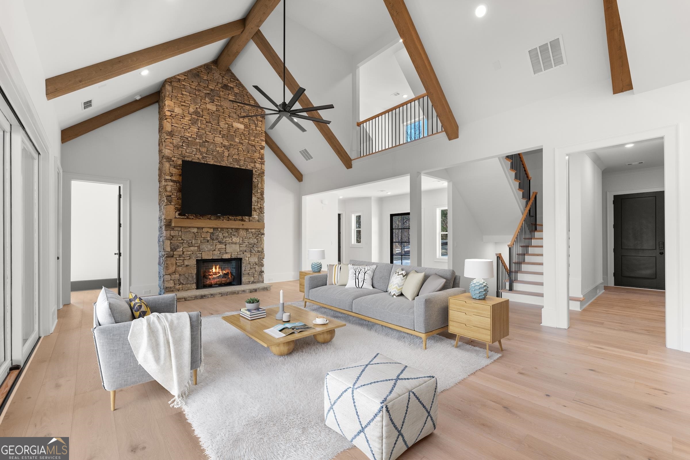 This is an AMAZING opportunity to own a brand new construction home on the lake! The builder has spared no expense on all of the finishes, windows, flooring, appliances, an elevator that accesses all 3 floors as well as a generator. This is THE home that many of you have been searching for and haven't been able to find. As you walk in the glass front door, you'll have to stop right there to take it all in. The vaulted ceiling, open concept floor plan encompasses the great room, gourmet kitchen, huge dining area and the massive, covered porch with a wood burning fireplace. You will be able to entertain to your heart's delight. aThere is even a special area for your Christmas tree or a baby grand piano. The owner's suite on the main level has gorgeous, seasonal views of the lake with a lot of natural light and the spa-like master bath is a treat with 2, yes 2, huge his and her closets. On the upper level is a loft overlooking the main level and a very large bonus room/bedroom with a full bath. 2 walk-in attic spaces are great for storage and have conditioned air in the attics with spray foam insulation for energy efficiency. As you stroll down to the terrace level, you'll notice one of the bedrooms has been designed as an in-law suite, complete with a roll in shower that is wheelchair accessible. There is also a full kitchen in the terrace level making it convenient for a teen or in-law suite or entertaining all of your friends and family. aThe ceilings in the lower-level measure at or above 10'. The terrace level also includes a 4th bedroom and another (5th bedroom) or home gym area, complete with a steam shower, bringing the total lower-level bathrooms to 3 full baths. The window in the gym area does not have ingress or egress. aThe builder added a walkway from the driveway around the side of the house to the lower level. aHe also saved an area that would be perfect for the new owner to add a pool, if so desired. aThe 2 car garage is over-sized at 33'wide, 25' deep and 10' garage doors for the guys that have big trucks! As an added benefit, a generator will be the envy of your neighbors if we get a rare hard freeze and the power is out. aThis lovely home has a slip in the community dock that is always in deep water. This home is located within 10 minutes of Northeast Georgia Medical Center and a few minute drive or boat ride to the Olympic Rowing Venue that has food trucks, concerts and firework shows during the warmer months. You will also be close to downtown Gainesville, a thriving area of new restaurants, breweries and walking trails. Please call to see this gem of a home that will be your pride and joy!