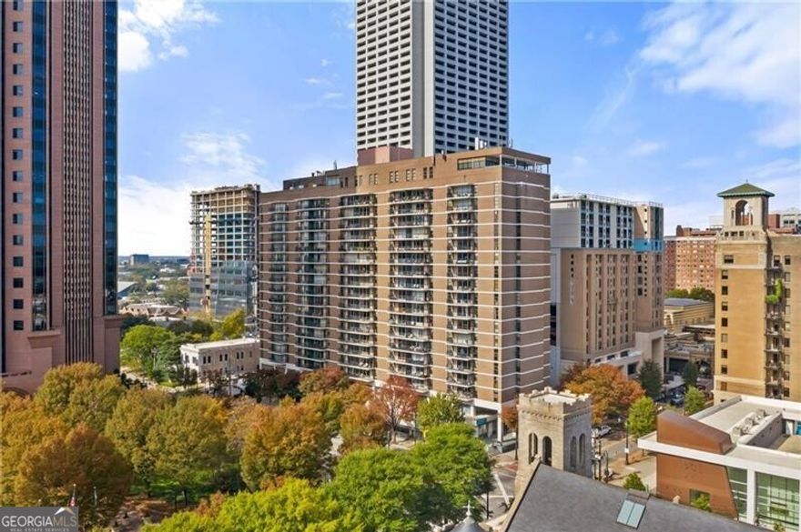 HIGHLY MOTIVATED SELLER!!!  Interior has been recently painted.  . Incredible end unit in prime Midtown Atlanta location! One block from the Fox Theatre, across the street from Emory, steps away from Ga Tech and Marta. Piedmont Park and 100's of restaurants are in walking distance! This home has been completely renovated with an updated kitchen with stainless appliances, granite countertops and tile backsplash. Both baths have been renovated as well. Both bedrooms are large and there is an additional Office area and Family Room. New LVP flooring throughout. The End Unit location gives this property amazing natural light and a dedicated private balcony overlooking both an incredible sunrise and sunset and wonderful city views from every direction! This building provides magnificent amenities on the mezzanine level including a freshly updated Club Room (can be reserved for private parties), Billiard Room with bar, Business Center, Conference Room, Gym, Outdoor Pool and Laundry Facilities plus 24 Hour Concierge/Security and Gated Parking. This home comes with 1 Parking Space - additional space can be secured for a nominal fee. The HOA covers water, trash, pest control, gas and amenities. This is a perfect opportunity for a first-time home buyer, investor, Ga Tech student or empty nester seeking a convenient stress-free lifestyle! HOA fees cover all amenities including security, one parking spot and utilities including HVAC,  except for your lights! (which sellers electric bill has never been over $50 a month) Second parking spot can be rented for $125/month.