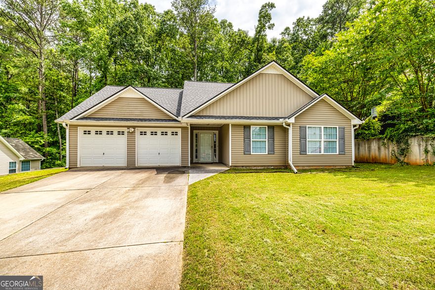 Welcome to this charming 3-bedroom, 2-bathroom home nestled on a level lot in a quiet, well-established neighborhood. With classic vinyl siding and a privacy fence surrounding the backyard, this home offers both curb appeal and a peaceful sense of seclusion.  Step inside to find beautiful hardwood floors flowing throughout the main living areas. The spacious family room features a cozy fireplace-perfect for relaxing evenings at home.  The kitchen is a true delight, complete with warm wooden cabinets, a gas stove, large pantry, and a convenient breakfast bar. Enjoy casual meals in the eat-in kitchen, and take advantage of the adjacent laundry room for added functionality.  The master suite offers a tranquil retreat, boasting a generous en-suite bathroom with a separate soaking tub, walk-in shower, and double vanity.  This well-maintained home combines comfort, style, and convenience-making it the perfect place to call home.