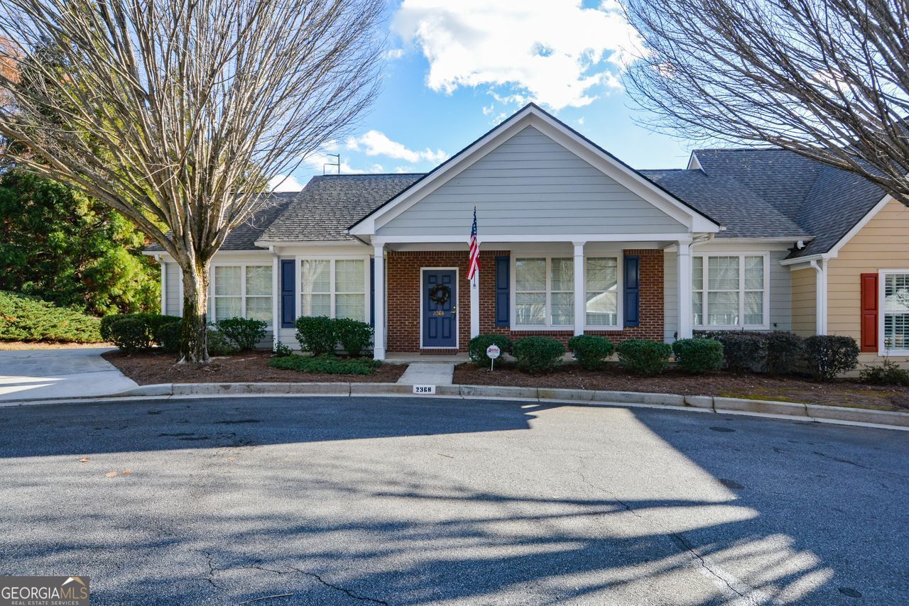 Coveted 3/2 ranch condo in the wonderful Cottages at Bells Ferry community. Easy living close to shopping and restaurants in the Town Center area of East Cobb. Well kept home on completely level lot with 2-car garage. Open kitchen with granite counters and breakfast bar. Enjoy the extra sunroom/office. Hardwoods throughout main living areas, with carpeted bedrooms. Primary bath has separate tub and shower. Separate laundry room. Upgraded light fixtures. HOA fee covers water, sewer, ext maintenance, trash, swim, and clubhouse. Experience an easy-going lifestyle!