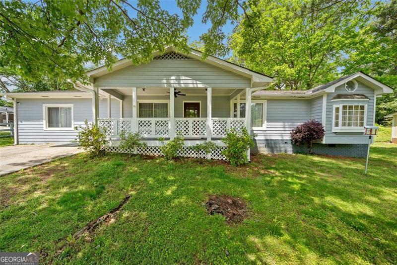 Welcome to this 3-bedroom, 2-bath ranch-style home located in a convenient West Cobb neighborhood. With a spacious family room and an open-concept kitchen and living area, the layout offers both comfort and flexibility-ideal for everyday living or entertaining. The kitchen features granite countertops, stained cabinetry, a tile backsplash, and stainless steel appliances. One of the bathrooms has been recently updated, bringing a clean, modern feel to the space. Step outside to a large, fenced-in backyard with plenty of room for kids, pets, or outdoor gatherings. The seller has recently installed new gutters and completed repairs to the siding and exterior woodwork, making this home move-in ready with key improvements already taken care of. Whether you're a first-time buyer, downsizing, or looking for a solid investment, this property is a great opportunity. Conveniently located near shopping, dining, and Cobb County schools.