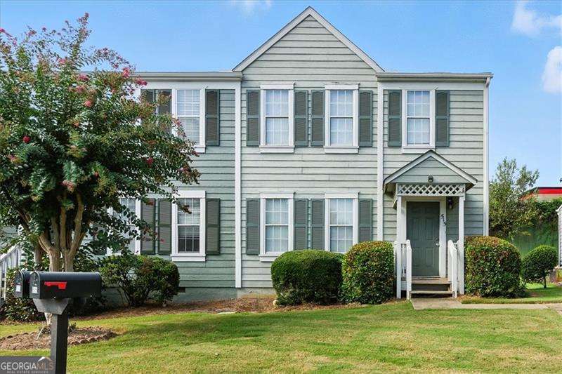 Welcome to this beautifully updated end-unit townhome, perfectly positioned just minutes from Kennesaw State University, Barrett Parkway, Marietta Square, and Kennestone Hospital. With no rental restrictions, this property is ideal for first-time homebuyers or savvy investors looking to expand their portfolio. Step inside to a light-filled, open layout featuring fresh paint and new flooring. The spacious fireside family room flows seamlessly to a private rear deck, perfect for relaxing or entertaining. A convenient half bath completes the main level. Upstairs, you'll find two generous bedrooms, each with its own private full bathroom, offering both comfort and functionality. Outside, enjoy the peaceful view of a green space right from your deck-an ideal spot for soaking up the sunshine or hosting a summer BBQ. Plus, the community pool offers a great way to beat the heat during the warmer months. For added convenience, two parking spots are located right in front of the unit. Enjoy easy access to shopping, dining, schools, major highways, and more. Don't miss this move-in ready gem in a sought-after Marietta location!