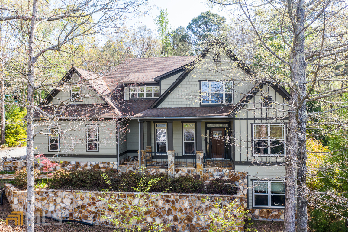 A truly must-see unique home with 6 bedrooms and 4.5 baths. Meticulously maintained, the Frank Lloyd Wright inspired home offers notable architectural features: The family room, screened porch, and one master bedroom have 16-foot vaulted wood ceilings that enhance the homeas open feel; A3/4 inch Brazilian cherry hardwoods grace the main flooras open living space; the dining room has stained, dentil crown molding; and the stone fireplace provides the perfect cottage feel to the open concept kitchen and family room. The kitchen and appliances were updated in 2018; soft-close cabinets include pull-out shelving. Granite countertops and ceiling fans are used throughout the home. With two master bedrooms on the main level this home is built to accommodate a multi-generational family or guests, the daylight basement would be the perfect in-law/guest suite with its separate entrance, bathroom, and large living space that is plumbed to accommodate a kitchen. The private, Callaway Garden like landscape on an acre lot features a variety of conifers and produces a kaleidoscope of color from spring through fall, with 23 Japanese maples, azaleas, Knock-out and Drift roses, dogwoods, redbuds, and much more.