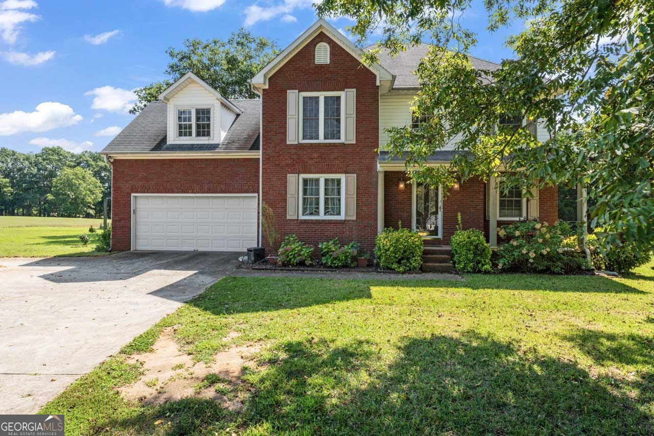 Get away from it all in this move-in ready 4 bedroom home on 2.38 acres. Enjoy quiet afternoons on the covered back porch, or evenings entertaining in the open kitchen with the wall of windows looking out to the private back yard. A formal dining room sits at the front, ready for dinners, celebrations, or even a study area, while the formal living room offers flexibility for an office, playroom, or hobby space. Upstairs, the primary suite has plenty of room to relax and unwind, while three additional bedrooms and a full bath provide space for everyone to spread out. 121 Wynn Drive is more than just a place to live - it's a home where gatherings flow easily, mornings begin with sunlight through the bay window, and evenings are best spent on the porch listening to the sounds of nature. Come see how this property can become part of your story.