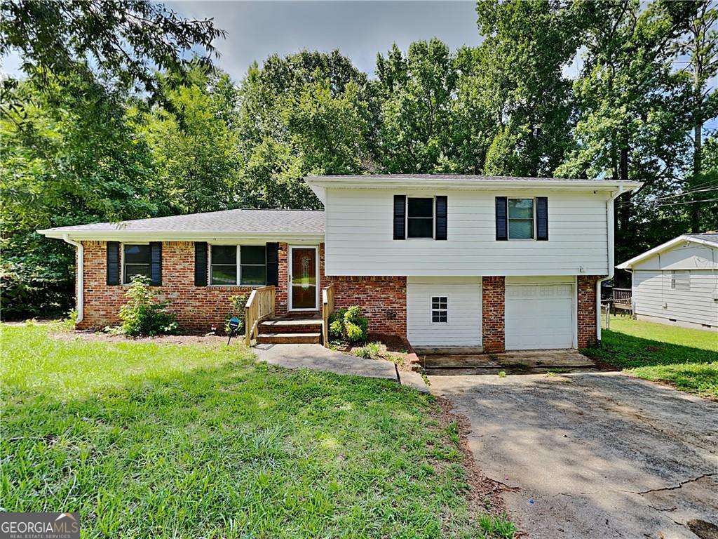 Gorgeous 4 bed 2 bath home with a garage. Upon entering, you'll notice the beautiful flooring that flows through the main level of the house and leads perfectly to the large deck overlooking the backyard. The main lever has ample space for entertainment in the two living areas or the spacious family room. The upper level contains the master bedroom that boasts its own private bathroom. As well as two nicely sized secondary bedrooms. The lower level contains the final bedroom and access to the garage which leads to the side yard. Great location not far from Atlanta Motor Speedway, Hartsfield Jackson airport, & downtown Atlanta. Hurry before it is too late! This property is eligible for deposit alternative coverage in lieu of a security deposit. For information and enrollment, please contact our leasing team and enjoy a deposit-free renting experience Specialized Property Management residents are enrolled in the Resident Benefits Package (RBP) for $42.00/month which includes tenant legal liability insurance, HVAC air filter delivery (for applicable properties), credit reporting, renter rewards program, and much more!