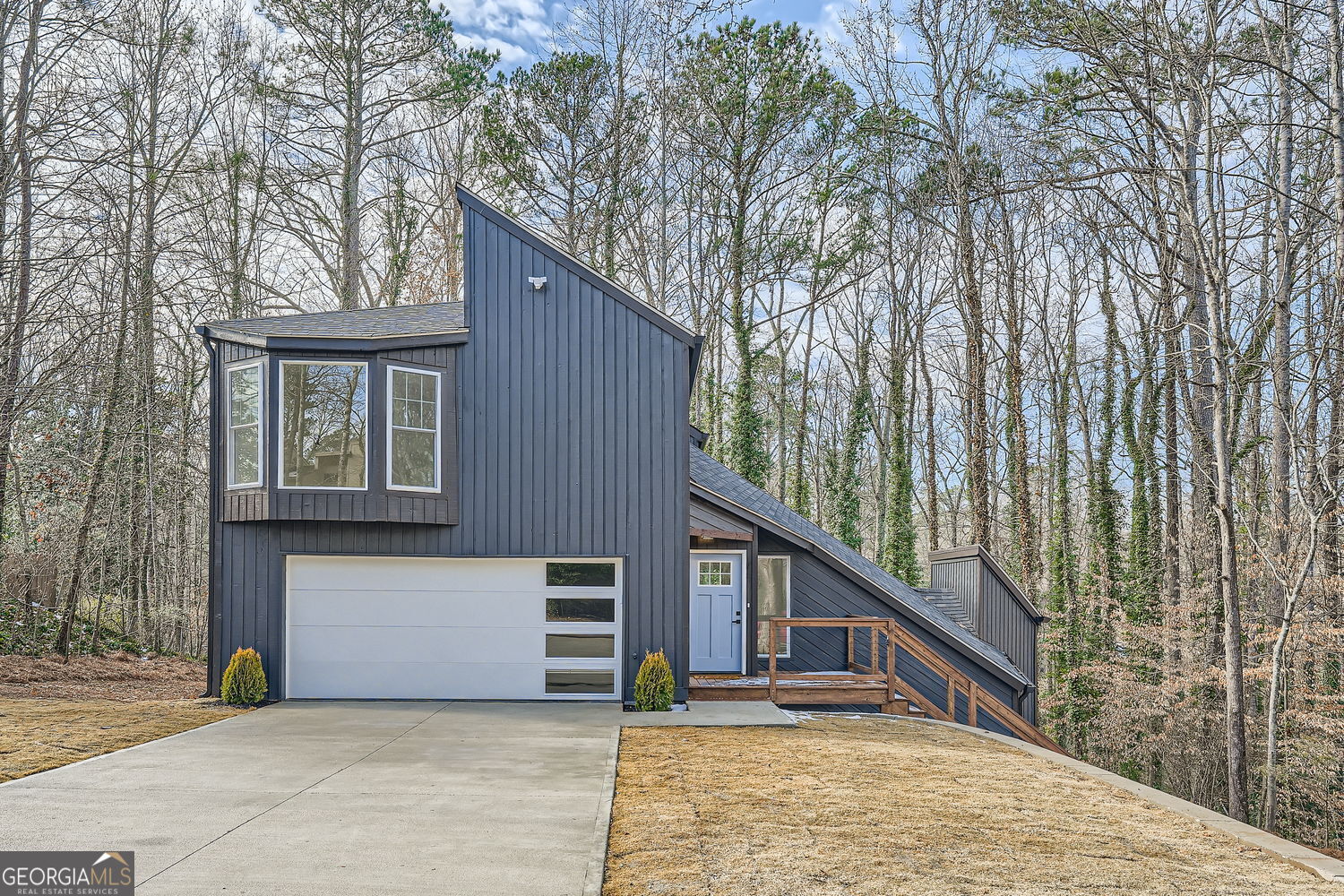 Welcome to an exceptional opportunity to own a stunning home in the highly sought-after East Cobb neighborhood, where you'll find the prestigious Pope High School just a mere 4-minute drive away! The spacious living room boasts 16-foot high ceilings and floods of natural light, creating an inviting ambiance. Recent upgrades include new flooring throughout, providing a cozy feel that complements the open floor plan. Other upgrades include a newer roof, HVAC systems, windows and driveway. The kitchen is a true highlight, with a center island, quartz countertops and ample storage. It's a chef's dream, offering not only functionality but also scenic views of the backyard and two newly stained & installed decks! New light fixtures add a modern and sophisticated touch throughout the home. The primary bedroom is a true sanctuary, featuring a double sink with spacious stand up shower and a generously sized walk-in closet. The additional bedrooms are well-proportioned, offering ample closet space for your convenience. The walk-out terrace level is a fantastic bonus ready for entertainment. This move-in ready gem is not only perfectly located but also boasts an impressive list of features that will exceed your expectations.