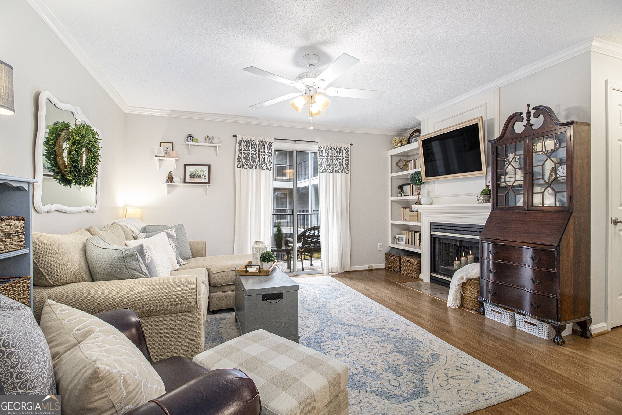 Welcome to The Granville, a Gated Community with No Rental Restrictions! This Immaculate, Updated Condo is in the heart of Sandy Springs, offering both style and convenience. Step inside to Hardwood Floors, Crown Molding, Wainscoting in the Dining Room, and Light-Filled Spaces anchored by a cozy Fireplace. The Kitchen features White Cabinets to the ceiling, Stone Countertops, Stainless Steel Appliances, and a Large Walk-In Pantry and Laundry Room. The Spacious Bedroom includes a Walk-In Closet, while the Full Bathroom offers generous counter space and a separate water closet with a shower/tub combo. Enjoy fresh air and morning coffee on the Covered Balcony overlooking the serene courtyard. Community Amenities include a Pool, Fitness Center, and Clubhouse. Additional highlights include Covered Gated Parking, Scenic Walking Trails, and close proximity to Perimeter Mall, Perimeter Business District, Northside Hospital, MARTA, GA-400, I-285, and Sandy Springs City Center. Just minutes from Costco, Whole Foods, Trader Joe's, and the Mercedes-Benz Headquarters. Includes 1 Designated Parking Space. Don't miss the chance to own one of the most desirable units in The Granville where comfort, location, and investment potential meet.
