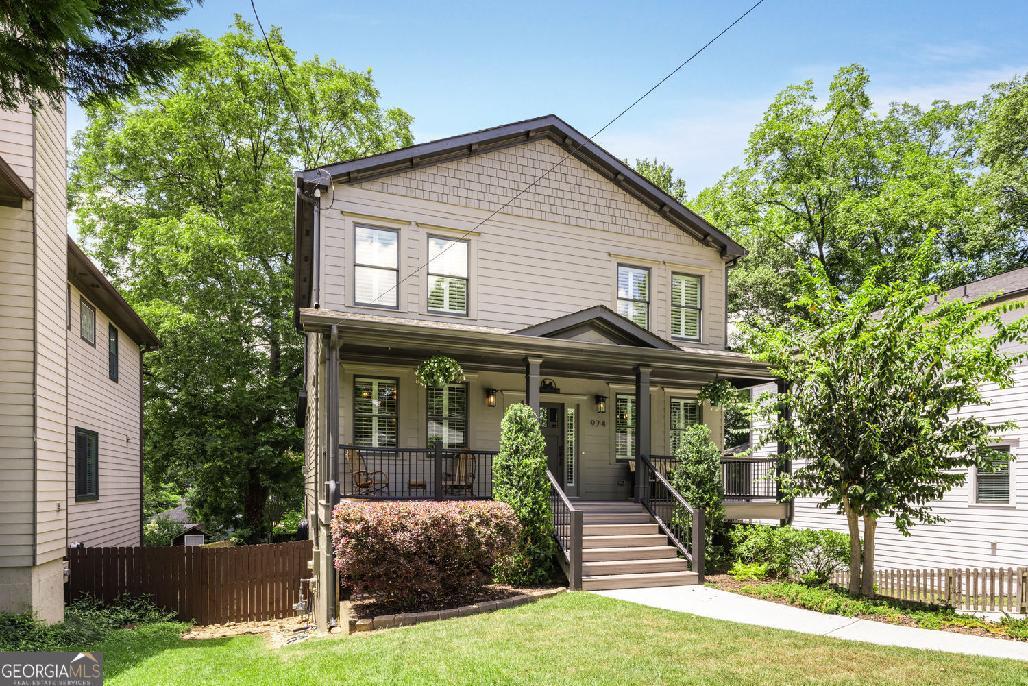 Howell Station is the Westside's crown jewel and 974 Rice St NW certainly sets the bar! Just a block from Westside Park, Atlanta's largest green space, and Beltline access, this craftsman gem was custom built in 2015 with extensive upgrades. A large covered rocking chair front porch with Trex decking spans the entire width of the house to welcome you and your guests. Inside, you'll find an open floor plan with hardwood floors and high ceilings throughout all finished levels. Featuring 3 bedrooms plus a main floor den, 2 full and 1 half bathrooms and a terrace level with a workshop stubbed for a bath and/or work sink, multiple storage rooms and an oversized 2-car garage with 20' custom door and epoxy floors, wide enough to park 3 cars. The chef's kitchen features leather granite countertops, new refrigerator (2025), under cabinet lighting, stainless steel appliances, gas range with commercial grade, exterior vented hood and oversized counter-height island. The kitchen is open to the family room with ventless gas fireplace, custom built ins and French doors opening to the screened porch with low maintenance Trex decking and wood burning fireplace, perfect for al fresco dining and relaxing while the adjoining open-air deck is ideal for grilling and time in the sun. Back inside, the separate dining room is perfect for family time and dinner with friends. Working from home is a dream in your private office with barn door and custom built-ins. Upstairs, the primary suite features a ventless gas fireplace, custom walk-in closet and oversized spa bath featuring a massive frameless glass marble shower and marble herringbone floors. Two additional secondary bedrooms have custom closets and plantation shutters and share a hall bath with double vanities. Laundry is conveniently located in the upstairs hallway as well. The level backyard features a 6' wooden privacy fence and has just received a complete makeover with new sod and landscaping, built-in fire pit and brick pathways with plenty of room for a potential pool or swing set. You'll also love the rear covered patio with 6-person hot tub. This house is meticulously maintained and move-in condition with $45k in recent updates including complete exterior painting (2025); interior painting (2024); epoxy garage floors; new sod, landscaping, brick pathways and fire pit; new HVAC (2023), water heater (2025), refrigerator (2025); plantation shutters throughout. The neighborhood features parks, playgrounds, tennis and pickleball courts and is a few blocks to Westside Park and Beltline access, minutes to King Plow Arts Center, the trendy Howell Mill/Westside Provisions district, some of Atlanta's most desirable shopping, restaurants and entertainment as well as midtown and downtown.