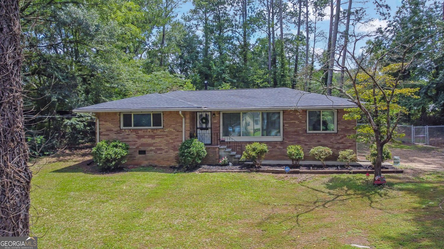 Welcome to 6361 Dodgen Rd SW, where classic charm meets modern upgrades. This beautifully updated 2-bedroom, 1-bath brick home sits on a spacious 0.7-acre lot with fresh landscaping, brand-new mulch, and instant curb appeal. Step inside to find a fully renovated kitchen and bathroom, both finished with stylish, high-quality touches. The Seller preserved the original hardwood floors, offering warmth and character throughout the home. A fresh coat of paint brightens every room, creating a clean and inviting interior. The home is well-maintained with a brand-new roof, 3-year-old water heater, and 7-year-old HVAC system, giving you peace of mind from day one. Enjoy a long driveway for ample parking and space to spread out on this generous lot. Whether you're a first-time buyer, downsizer, or investor looking for a turnkey opportunity in Cobb County, this gem is move-in ready and packed with value. Location perks: Convenient access to I-285, shopping, parks, and all that Mableton has to offer.
