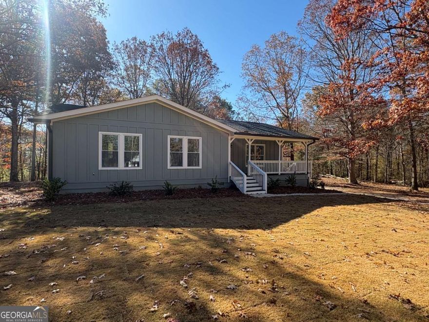 Beautifully renovated home situated on 2 private acres, offering an ideal blend of modern finishes and comfortable living. The open floor plan features LVP flooring, recessed lighting, and a functional breakfast bar overlooking the main living area. The kitchen is updated with granite countertops and contemporary design elements throughout. The spacious primary suite includes an en suite bath with a tile walk-in shower and double vanity. Two additional airy bedrooms, each with walk-in closets, share a convenient Jack and Jill bathroom with a tub/shower combo. A large workshop provides excellent storage, hobby, or project space. With ample room indoors and out, this property offers comfort, privacy, and versatility.