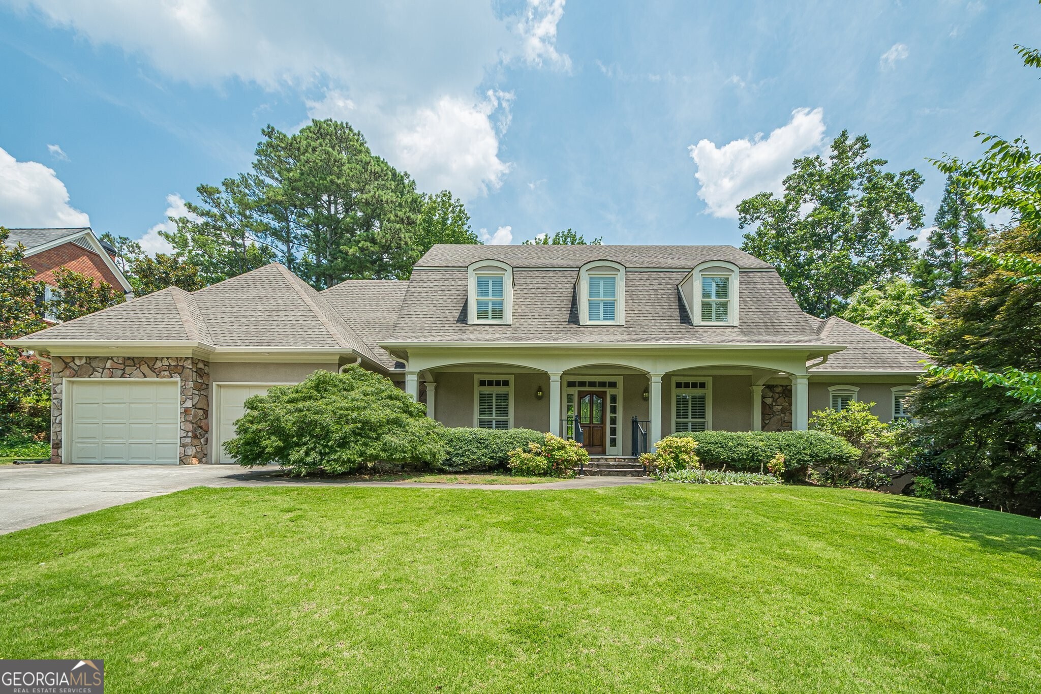 Welcome to this beautifully updated home featuring new carpet and flooring though out and freshly painter interior! Shows like new! Inviting foyer opens to gleaming hardwood floors, a formal living room, and banquet size dining room - perfect for entertaining! The gourmet kitchen offers custom cabinetry, built-in desk, and large pantry. Sunny breakfast room. Expansive great room boasts a stunning rock fireplace with gas logs and starter, flanked by custom built-in cabintry. Soaring ceilings. The oversized owner's suite on the main level has two generous walk-in closets and a luxurious spa-like bath with double vanities, a whirlpool tub, and separate shower. Upstairs, you'll find two oversized bedrooms connected by a large Jack-and-Jill bath, plus versatile loft area - ideal for a home office, reading nook, or play space. The full, unfinished basement offers endless potential for expansion! Already framed and stubbed for bath, this space is ready to be customized to suit your lifestyle needs. Additional highlights include a two-car garage, central vacuum system, sprinkler system. Handicap accessible. Located in a top-rated school district and minutes from shopping, dining, Kennesaw Mountain and The Avenues, this home offers both convenience and charm. Home shows like new and ready for your arrival today!