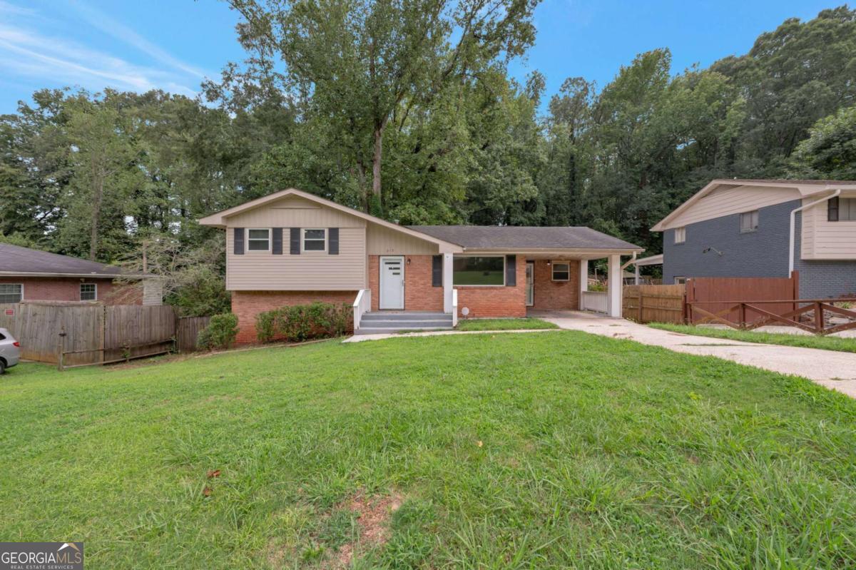 Welcome to 919 Slash Pine Rd in Forest Park, a charming home offering comfort and convenience in a quiet neighborhood. This residence features a spacious living area filled with natural light, a functional kitchen with plenty of cabinet space, and well-sized bedrooms designed for everyday living. The property includes a large backyard, perfect for outdoor gatherings, gardening, or simply enjoying the fresh air. Conveniently located near schools, shopping, dining, and major highways, this home provides easy access to everything Forest Park and the surrounding areas have to offer. Whether you're a first-time buyer or looking to invest, this property is a wonderful opportunity.