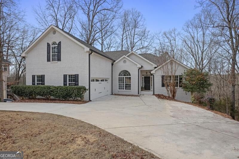 This stunning newly renovated 6-bedroom home offers over 4,000+ sq ft of beautifully designed living space tucked away on a peaceful street! The heart of the home is an amazing kitchen with crisp white shaker-style cabinetry, gleaming quartz countertops, and a spacious island, perfect for gathering and meal prep! Natural light floods every room creating a bright and inviting atmosphere! Large sliding glass doors open to a spacious deck with serene wooded views. The multi-level decks extend the living space outdoors, offering plenty of room for relaxation, dining, or entertaining. The finished basement serves as a comfortable, self-contained living space with a convenient kitchenette, two bedrooms, full bathroom and an open living area-perfect for guests, or extended family. Bottom level has oversized barn doors, ideal for storing large recreational vehicles or transforming into a workshop, ample space for hobbies and storage! This unique, incredible home is move-in ready and waiting to be enjoyed! No HOA.