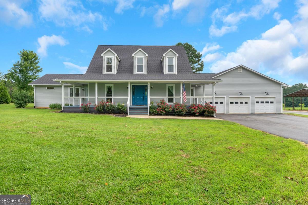 It's here-this listing has it all! Tree-lined drive leads to this 21-acre property with a 3,417 sf 5BR/3BA home + office and wraparound porch. Includes a 970 sf 3-car garage, 1,030 sf workshop, 1,097 sf garage/shop, 3,600 sf pole barn, and 1,200 sf studio with full bath-used as office/apartment. Pasture is partially fenced with cows, gently rolling with wooded area and spring. Also features grape vines, blueberry bushes, pecan and peach trees. Convenient to shopping, restaurants, Tanner Health, Franklin, Lagrange, Newnan & I-85. Property Split into 2 tracts: Tract 1: 500 Coleman Mill Rd-18.355 acres with house, garage, workshop, shop, pasture with a spring. Tract 2: 520 Coleman mill Rd -2.879 acres with pole barn, studio, and fruit trees and bushes Inside: two-story foyer, living/library room, kitchen open to dining/great room with wood-burning fireplace and view of "farm." Primary BR on main with private patio + guest BR and office with private entry and a media room. Upstairs: 3 BR's, updated full bath, fresh paint & flooring. Ideal for working from home, rental studio, livestock, or hobby farming. The pole barn is perfect for hay and equipment storage. This live-work family farm is ready for you. Make your appointment today!