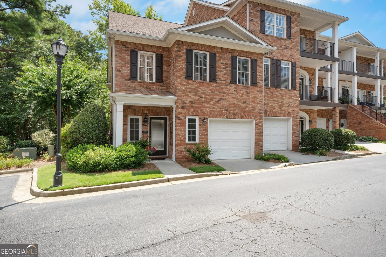 Gorgeous end unit, 3 level townhome, in the heart of Brookhaven. Walk to shops, restaurants, cafes, and public transportation. Splendid layout with a great entry hall for greeting guests. The kitchen is open to the living room and dining room. Plus French doors off of the living room lead to the charming rear patio that overlooks a nice parklike setting. The second floor features 3 bedrooms including the large master suite with spacious master bath and large walk-in closet, and laundry closet on the second floor. From the master bedroom go up another level to the bonus bedroom/office/fitness space. Plus large walk in storage off of the third level. The neighborhood gates close in the evenings.