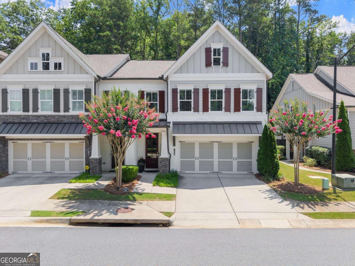 Welcome to your dream home in the perfect location-conveniently nestled just off Hwy 92, minutes from both downtown Roswell and downtown Woodstock. This stunning 3-bedroom, 2.5-bath end-unit townhome feels nearly custom with its high-end finishes, open-concept design, and abundant natural light throughout. Step inside to find engineered hardwood floors flowing through the main level, and a panoramic sliding door opening to your private patio-perfect for seamless indoor-outdoor entertaining. The spacious kitchen boasts an oversized island, gas stove, generous cabinetry, and a custom walk-in pantry. A thoughtful mudroom area just off the garage keeps things tidy, while the oversized laundry room offers built-in cabinetry and a sink. Every bedroom features custom closet systems, and the oversized primary suite includes a bonus sitting area or office space. The spa-like primary bathroom offers a double vanity, soaking tub, and a large tiled shower with a waterfall shower head. Additional highlights include: - Elevator shaft ready for future installation - End-unit location with extra windows and natural light - Ample storage and designer details throughout Enjoy community amenities including a dog park, walking trails, firepit, and a covered gazebo with a grill station-ideal for gathering with friends and neighbors. This home blends luxury, convenience, and lifestyle-schedule your tour today and fall in love!
