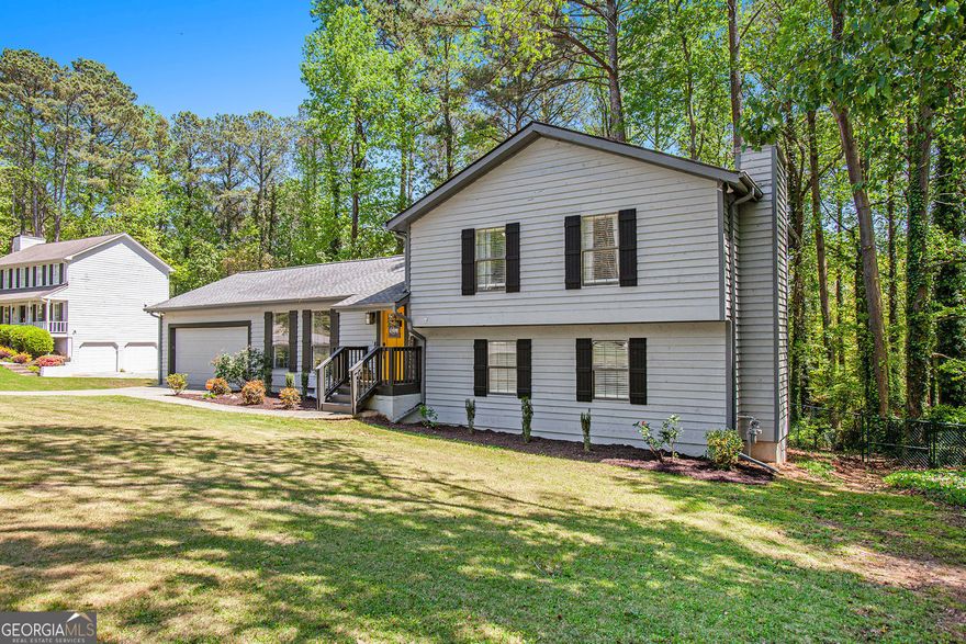East Cobb stylish split level home just hit the market in Marietta! This charming home gives you 4 bedrooms and 3 full updated bathrooms. The main floor offers a kitchen with newer stainless appliances, open floor plan, and high ceilings. The lower level living space has an additional guest bedroom, living room with cozy fireplace, full updated bathroom, built in desk, and covered patio. This move in ready home also boasts a large professionally landscaped yard, large deck, and cul-de-sac, for outdoor enjoyment. Located in the nationally ranked Wheeler HS district, this home is zoned for Sedalia Park Elementary, and East Cobb Middle. It is close to shopping/dining, convenient to I-75, and all that East Cobb has to offer. It won't last long, so set up your showing time appointment today.