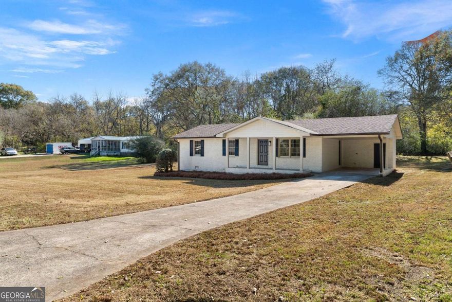 Prepare to be impressed by this beautifully remodeled 3-bedroom, 2-bath home that has been thoughtfully updated from top to bottom. Step inside to an inviting open floorplan enhanced by a stunning accent wall and all-new fixtures and lighting throughout. The completely redesigned kitchen serves as the centerpiece of the home, featuring quartz countertops, new cabinetry, stainless steel appliances, and an expansive island that provides ample workspace and the perfect setting for gathering. Both bathrooms have been fully renovated with stylish vanities, modern tile showers, and contemporary finishes that add a touch of luxury to everyday living. Additional updates include a brand-new roof, new HVAC system, fresh interior paint, and new flooring throughout, ensuring a truly move-in-ready experience. Situated on a generous lot, this property offers plenty of space for relaxing, entertaining, and enjoying the outdoors. With its combination of modern charm, quality craftsmanship, and thoughtful design, this home is ready to welcome its next owner.