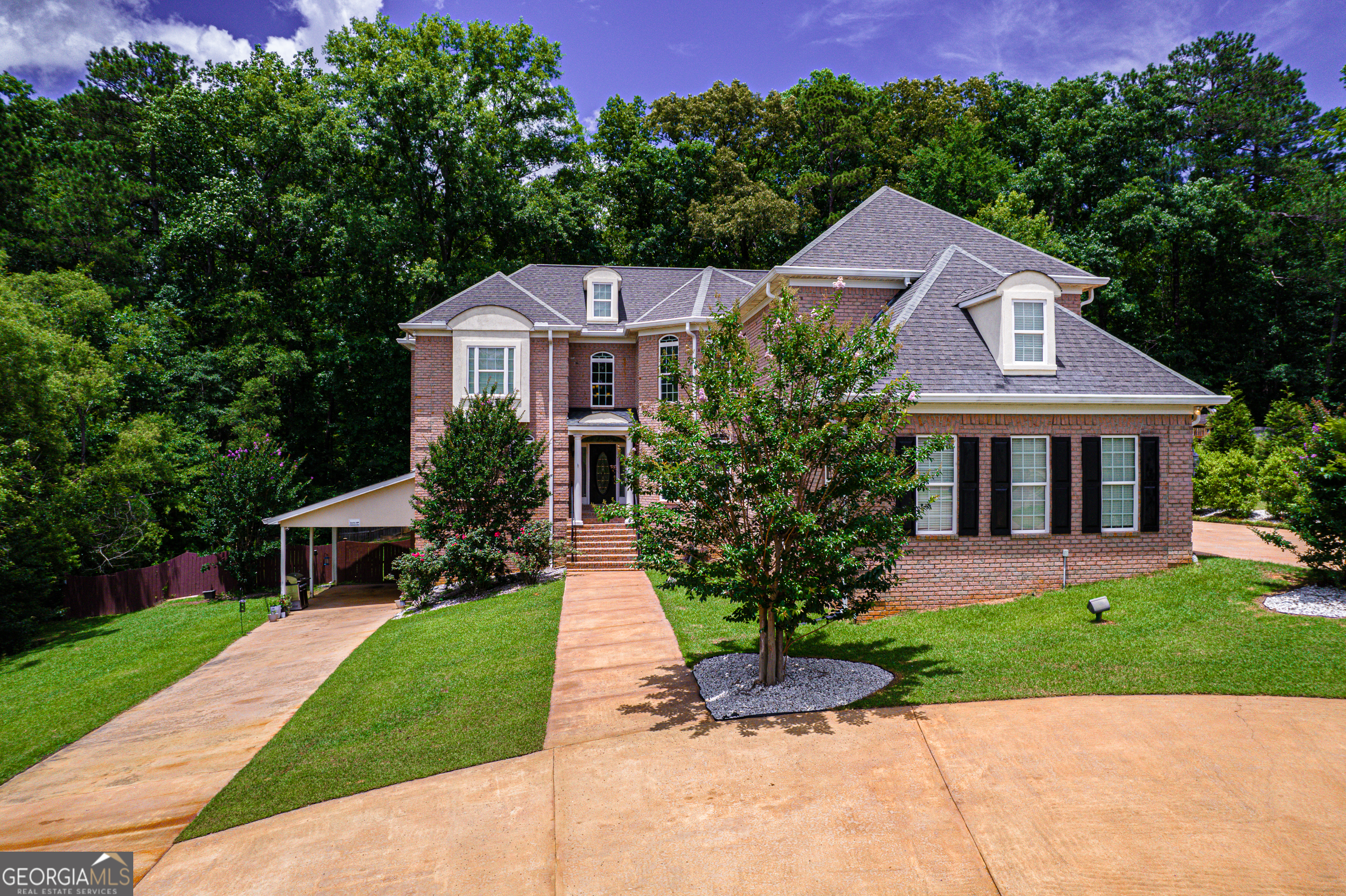 Custom-Built Beauty in North Macon- Designed for Comfort, Space & Entertaining Welcome to this stunning, custom-built home in North Macon's highly desirable Madison subdivision. With almost 6,700 square feet of thoughtfully designed space, this nine-bedroom, six-and-a-half-bath home is ideal for multi-generational living, large families, or anyone needing room to grow and gather. Inside, you'll find rich hardwood floors, detailed custom trim work, and molding throughout-showcasing the craftsmanship and care that went into every corner of this home. The spacious kitchen is a true standout, featuring extensive cabinet and counter space perfect for the home chef and ideal for entertaining. Whether you're preparing a weeknight meal or hosting the holidays, this kitchen delivers both function and style. The main living area includes six generously sized bedrooms, each with its own private en-suite bath-ensuring privacy and comfort for all. A three-car garage provides plenty of parking and storage, making everyday life that much easier. Downstairs, a fully finished basement offers incredible flexibility with three additional bedrooms, two full baths, a full kitchen, living area, and laundry-perfect for in-laws, teens, or potential rental income. Conveniently located near shopping, dining, and with easy access to the interstate, this home combines thoughtful design with unbeatable location. Schedule your private showing today and experience all the space, warmth, and possibilities this home has to offer!