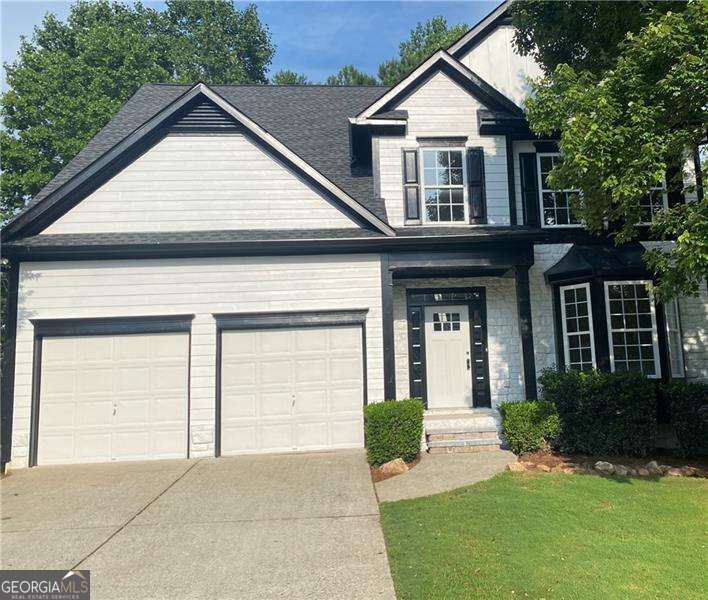 Home has been masterfully renovated! New roof, New gutters, New 50 gallon water heater, New AC (each floor has HVAC), New ext.& int paint, New shaker cabinets, New backsplash, New quartz/quartzite countertops New SS LG apps, New recessed lighting, New light fixtures, New refinished hardwoods on main and stairway, New LVP upstairs New shaker vanities in baths with marble and quartz tops, new faucets, New shower tile with new frameless shower in master, New stand alone tub, New tub and tile in hall bath, New low flow toilets, New marble hearth and stone around fireplace. Full finished basement with living room, bedroom, full bath and full kitchen with new SS apps, New decking & handraiil. Pool and playground right across the street. 5 Min from 1575, 10 min from Downtown Woodstock, 5 min from groceries, aquatic center, 7 min to Lake Allatoona and 15 min to Hospital. Brand New Cherokee High School opens in 2026! Need to close with Hartman Law Woodstock who has started title work. Matt Lillquist with GA Platinum offering $1000 towards closing costs if used as the lender.