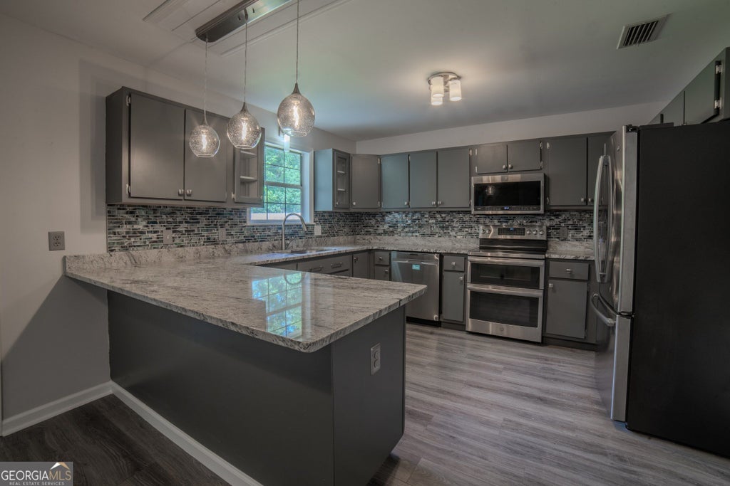Photo of 303 Ethridge Drive, Brunswick, GA 31525 (MLS # 10852964)