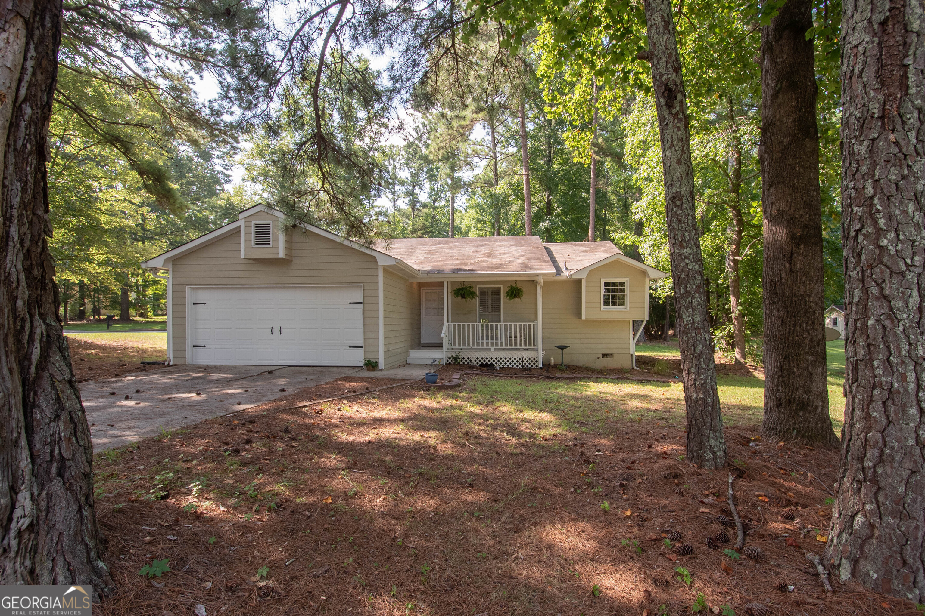 Beautifully laid out ranch on a quiet street in lovely Peachtree City! This cozy 3 bed/2 bath home is located on the southside of Peachtree City in the highly desirable Starr's Mill high school district. The kitchen boasts plenty of cabinet space, beautiful new quartz counters and a brand new dishwasher. Relax in the shade on your front porch or lounge out back in the spacious screened in patio overlooking the sizeable fenced in yard. Newer LVP flooring in all three bedrooms and living room, tile entry and kitchen. The large primary suite boasts privacy apart from the two secondary bedrooms with a large bathroom and walk-in closet with an efficient custom closet organizer system. Come see all this home has to offer and find out why so many people have chosen to call Peachtree City home!