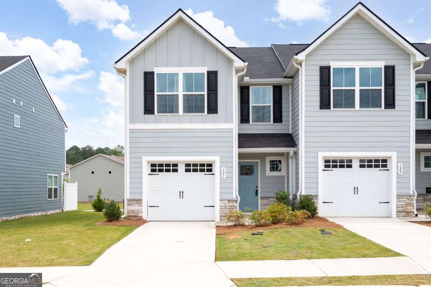 Charming end-unit townhome near downtown Cartersville & Main Street shopping! This beautifully maintained 3-bedroom, 2.5-bathroom home offers comfort, convenience, and a low-maintenance lifestyle. With easy access to I-75, commuting is a breeze! Step inside to an open-concept main level featuring luxury vinyl plank flooring, recessed lighting, and an abundance of natural light. The bright and stylish kitchen features white quartz countertops, stainless steel appliances, and a spacious pantry, making it perfect for entertaining or everyday living. The adjoining living and dining areas flow seamlessly out to a private outdoor patio with a privacy wall, creating the ideal space for relaxing or enjoying a quiet evening. Upstairs, the spacious primary suite has an oversized walk-in closet and a private ensuite bath with a double vanity and a tub/shower combination. Two additional bedrooms share a full bathroom, and the laundry area is conveniently located on the same level. Further highlights include a one-car garage with an epoxy floor and a low-maintenance exterior, as lawn care and exterior upkeep are covered by the HOA. Refrigerator, washer, and dryer are included with the home for a truly move-in-ready experience. Whether you're a first-time buyer, downsizing, or looking for a great investment, this townhome offers it all in a prime Cartersville location!