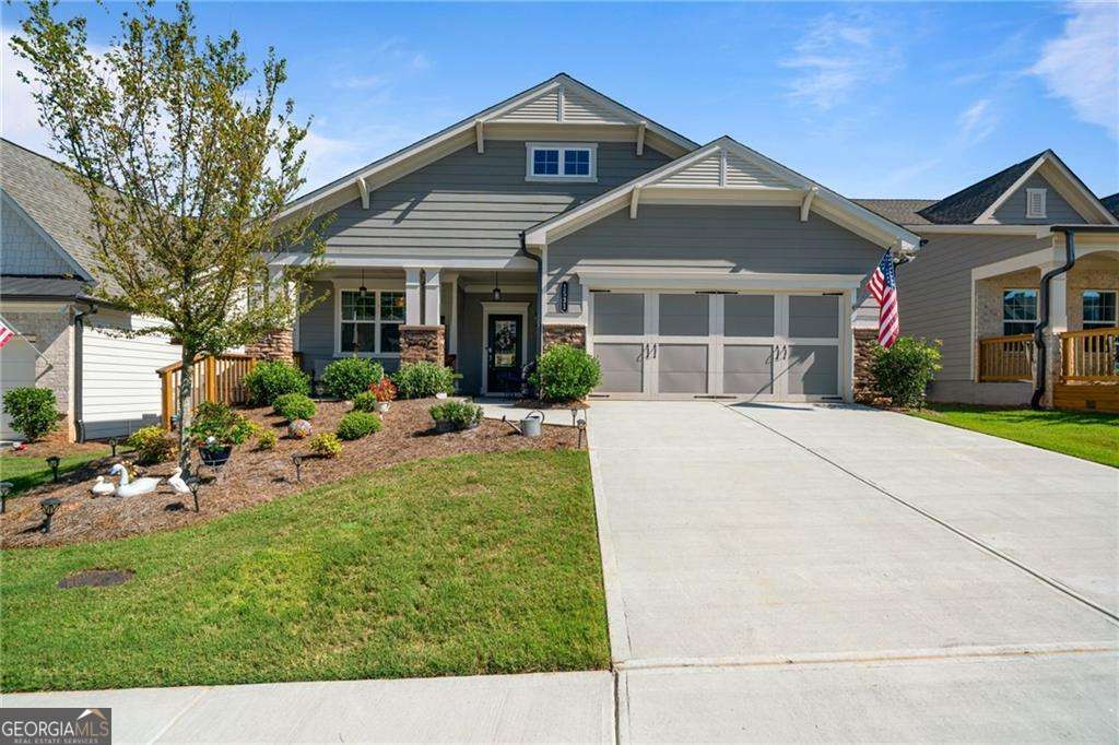 Welcome to your dream home in the highly sought-after 55+ community of Hickory Bluffs in Canton! This stunning 2024-built residence offers an ideal blend of modern design, comfort, convenience, thoughtful functionality, and many accessible rooms. Step into a spacious entryway that opens to a versatile living room or office with elegant glass double doors. To the right, a convenient mudroom leads to a generously sized two-car garage with ample storage space. A coat closet in the foyer adds extra practicality. The heart of the home features an open-concept layout with a chef's kitchen boasting white cabinetry, a large center island with quartz countertops, stainless steel appliances including a gas stove and range hood, and a walk-in pantry. The adjacent dining area flows seamlessly into the cozy family room, complete with a decorative fireplace, large storage closet, and built-in bookshelves perfect for relaxing or entertaining. Enjoy year-round comfort in the over-sized covered sunroom or step out onto the patio and back porch for fresh air and outdoor living with screens and blinds. The spacious owner's suite is privately situated at the back of the home, featuring a large walk-in closet and a spa-like bath with double vanities and a step-less walk-in shower. In the front there's a large secondary bedroom with a big closet, a full hallway bath with a tub/shower combo, and a sizable laundry room complete with thoughtful layout. Don't miss your chance to own this beautifully designed home in one of Canton's most desirable active adult communities!