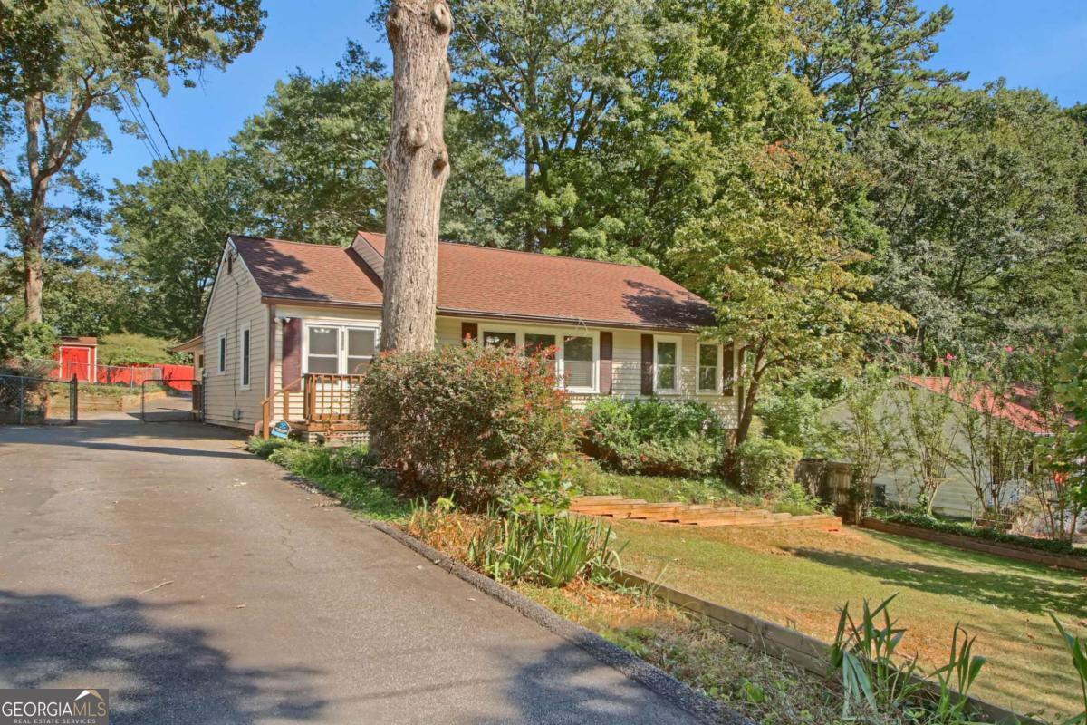 Welcome to this 3-bedroom, 1-bath home in the well-established Green Acres neighborhood of Smyrna. Nestled on a rare oversized level lot just inside the I-285 perimeter, this mid-century gem offers all the character of a mature community with plenty of room to grow. A spacious bonus family room provides flexible living space, while the screened-in porch and large deck invite you to relax or entertain outdoors. The crawl space is more than storage - with electricity in place, it's the perfect setup for a workshop, man cave, or hobby space. Green Acres is one of Smyrna's most convenient and affordable neighborhoods, close to schools, shopping, restaurants, parks, and major highways, giving you easy access to everything the city has to offer. Whether you're a first-time buyer or looking for a home you can update to your needs, this property is a wonderful opportunity to enjoy all that Smyrna living has to offer.