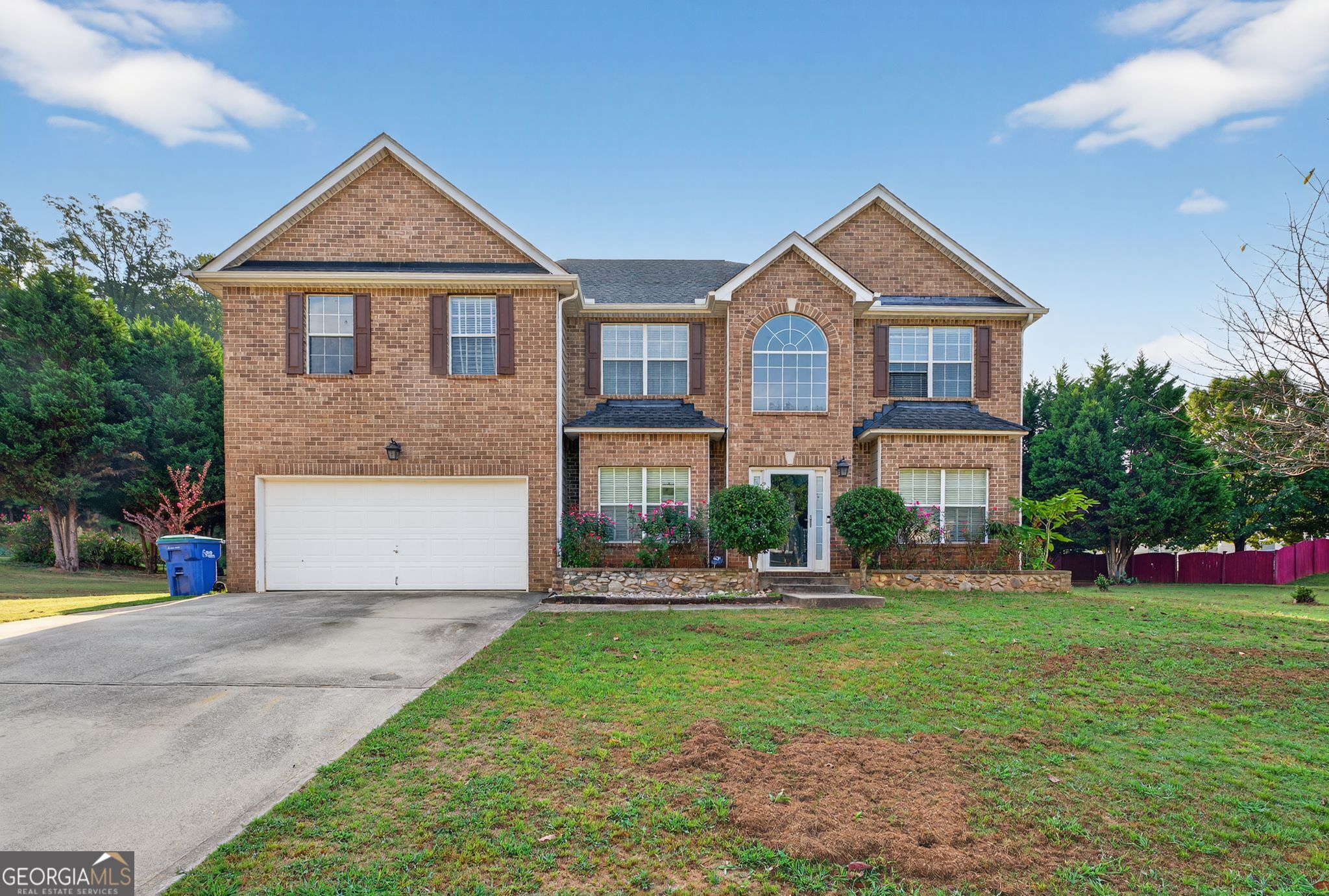 Step inside this stunning 6 bedroom, 4 bathroom home with over 3,600 sq ft of living space in the sought-after South Fulton area. Built in 2006 and beautifully maintained, this move-in ready property blends style, comfort, and convenience - perfect for a growing household or multi-generational living. A true cypress tree retreat with Fruit trees including Cherry Blossom, Apple, Plumb, Pear. Plus the non-fruit Cleveland Pear. And then there's this HUGE home with six bedrooms and four full baths. Flooring is hardwoods, bamboo, and carpeting throughout. From the moment you step inside, the two-story foyer sets the tone, flowing into a bright living room and dining area that stretch the full length of the home. On the main level, French doors open to a flexible bedroom/office - ideal for working from home, a guest suite, or even a private gym. The heart of the home is the chef's kitchen, featuring stunning South African quartzite counters, a large island, and an eat-in breakfast area overlooking the keeping/family room with a cozy fireplace. Beautiful bamboo flooring adds warmth and contrast throughout. Head upstairs to the oversized primary suite, complete with multiple closets, a walk-in large enough to double as a nursery, and a private sitting area. The spa-inspired bathroom and views of your garden arbor retreat make this suite truly special. Upstairs also includes a Jack & Jill bedroom/bathroom setup plus two additional bedrooms, updated with fresh paint, new AC, ceiling fans, and crown molding. The laundry room is conveniently located on this level as well. Outdoor Living at Its Best Enjoy a massive yard designed for fun and relaxation - from soccer games and frisbee to practicing your golf chip shots on the greens, or simply relaxing in the shade of mature cypress trees surrounded by spring blooms. All this just minutes from Hartsfield-Jackson Airport, Camp Creek Marketplace, and the best shopping and dining South Fulton has to offer. This one is move-in ready and a must see!