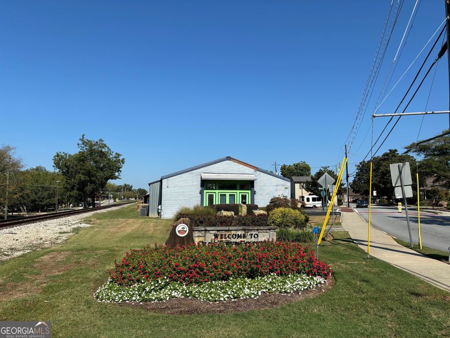 10,291 sf freestanding office building on 0.79 ac. Multi-tenant building featuring a reception area, 2 large conference rooms, several private offices, and a kitchen/break area. Located within Historic Downtown Conyers known as Olde Town Conyers. Zoned BGC, General Business District.