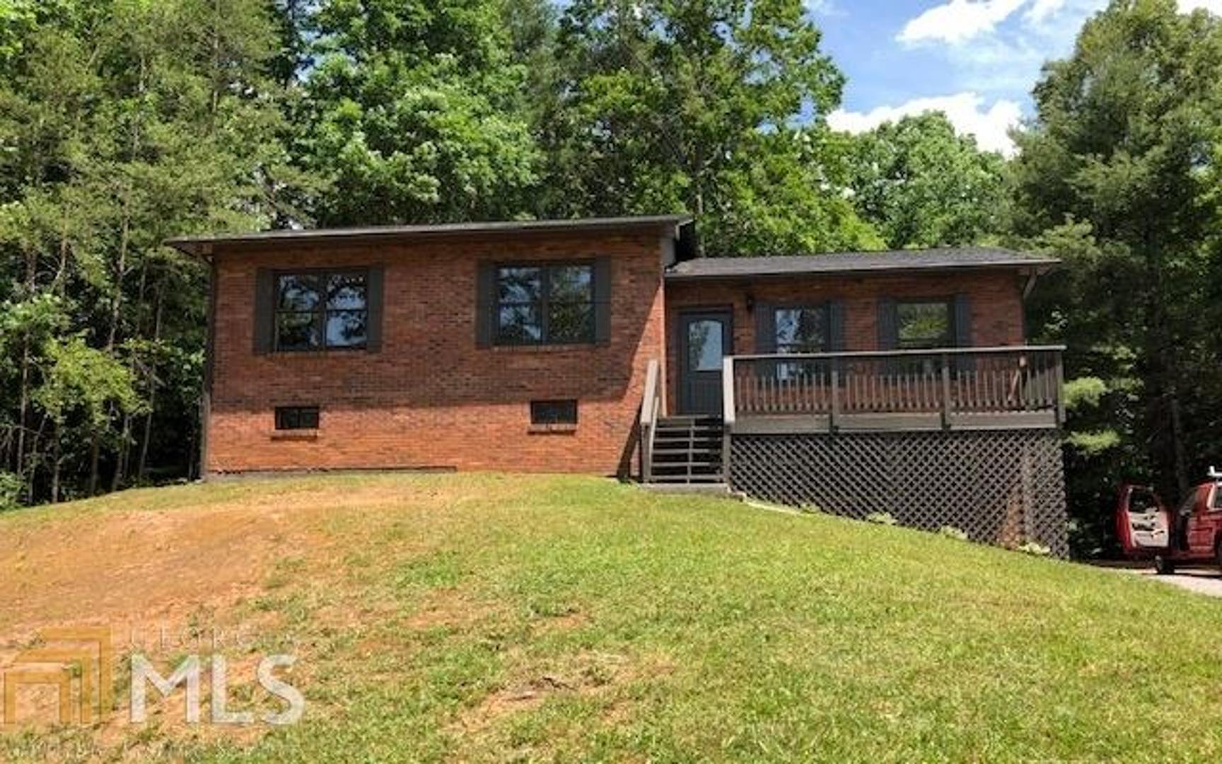 Best remodel ever! Three bedroom/3 bath home on .91 acres. New roof, new heat pump, 3 new bathrooms, new wood flooring, new lighting and new appliances. A Must See at this price!