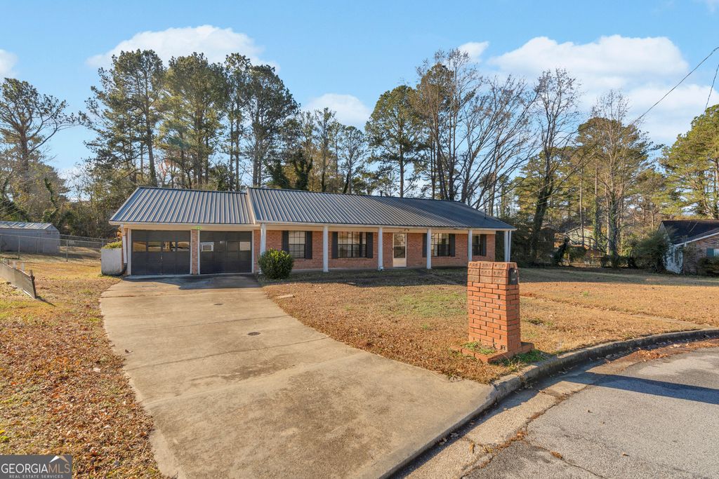 Photo of 1999 Sewing Circle, Lithonia, GA 30058 (MLS # 10660494)